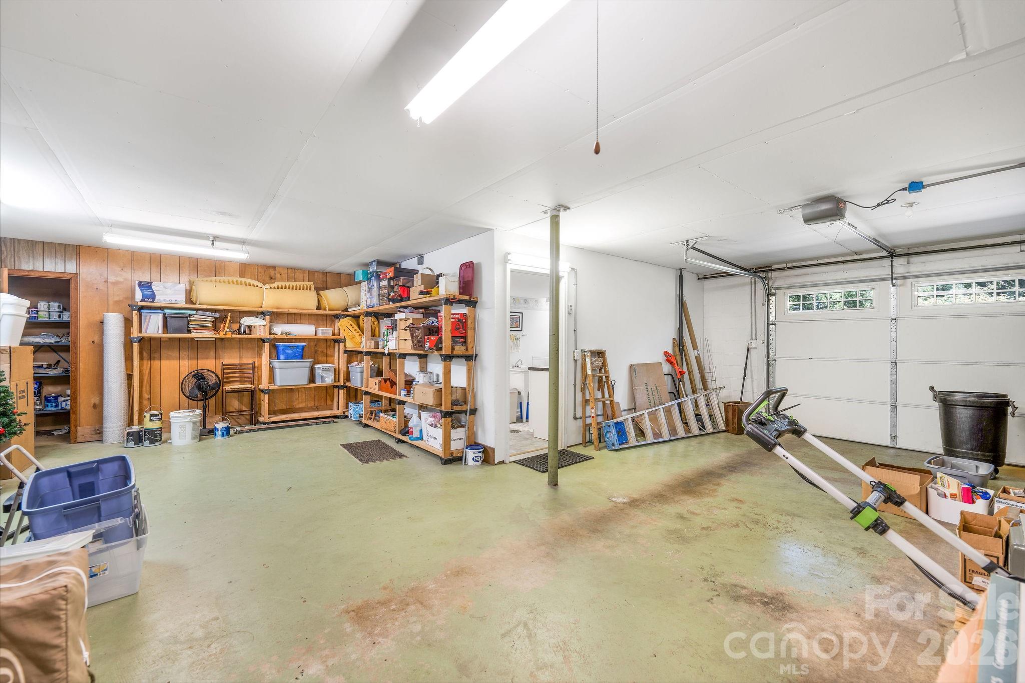 Lower level garage, storage and work bench area. - 1 Pheasant Ridge Drive, Asheville