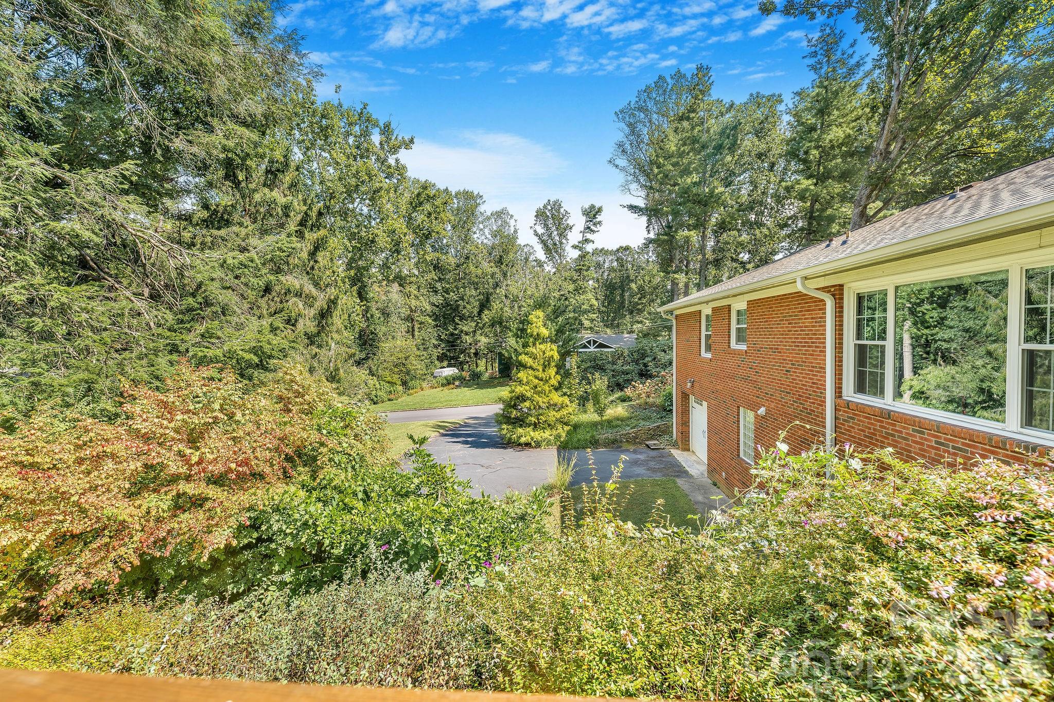 Second driveway to second garage and lower level living. - 1 Pheasant Ridge Drive, Asheville