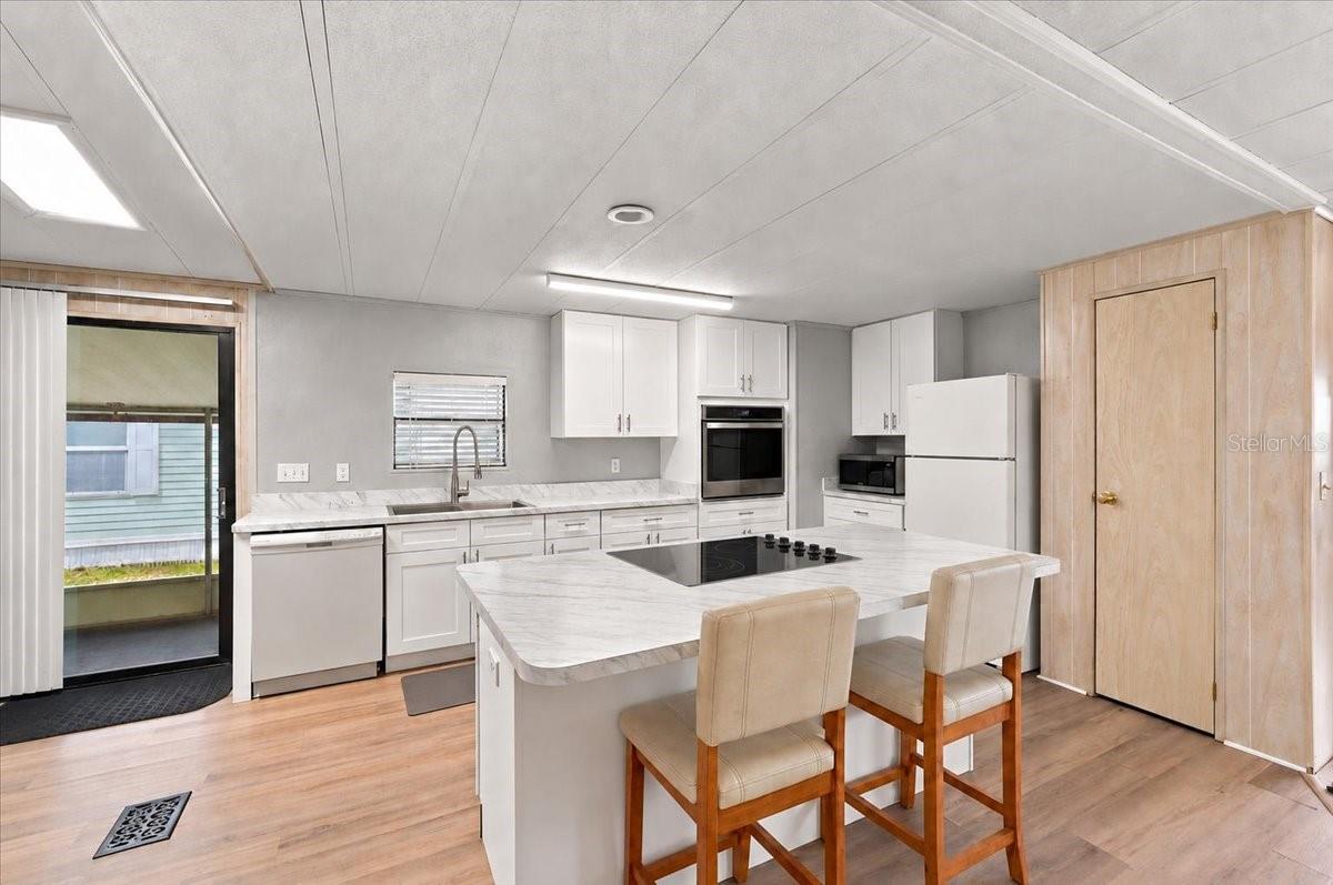 Updated Kitchen with New countertops and Island. - 4212 CEDARWOOD ST, WINTER HAVEN