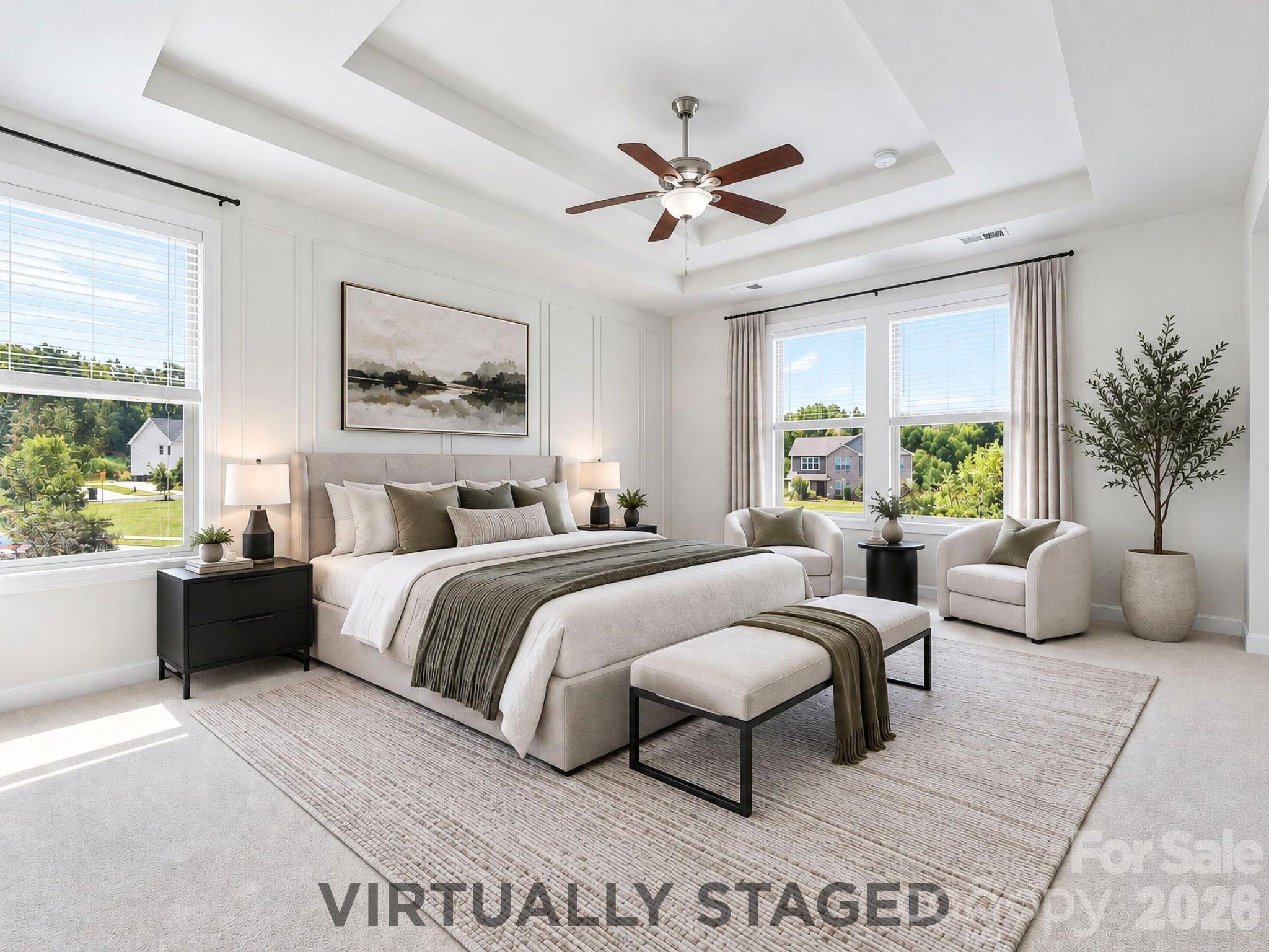 Virtually staged, the spacious primary bedroom becomes a serene retreat with room for a full furniture suite and a sunny sitting area. - 8315 Breton Way, Harrisburg