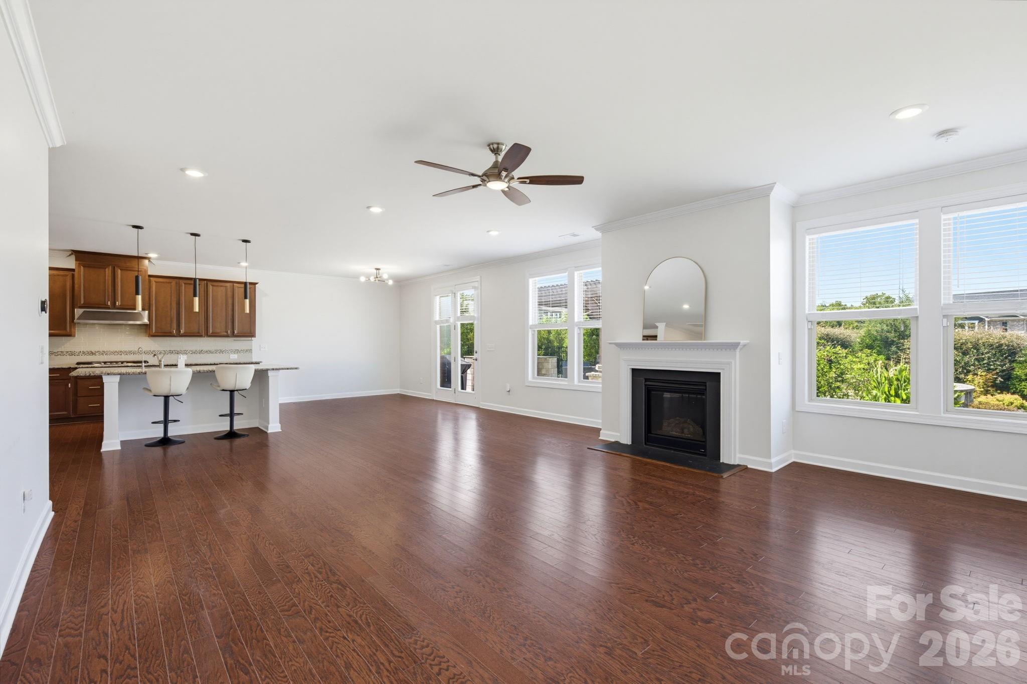 The kitchen and family room flow together in one bright, open space designed for the rhythms of everyday life - 8315 Breton Way, Harrisburg