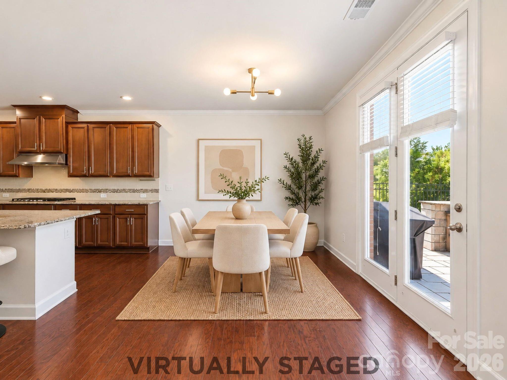 Virtually staged, the breakfast area offers a bright everyday dining space beside the kitchen, with direct access to the backyard. - 8315 Breton Way, Harrisburg