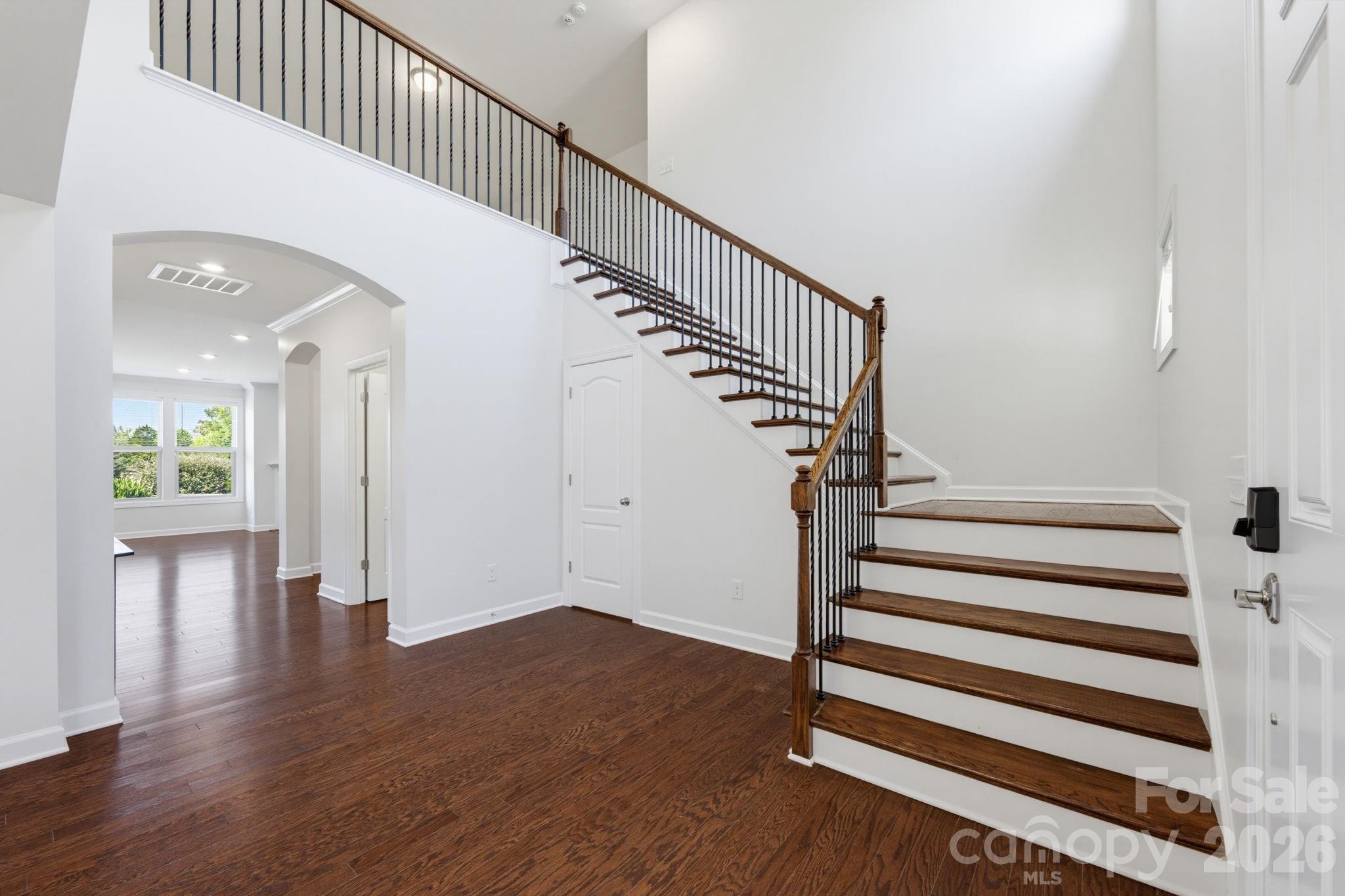 The open foyer and staircase set a gracious tone, with sightlines that make the main level feel connected and welcoming. - 8315 Breton Way, Harrisburg