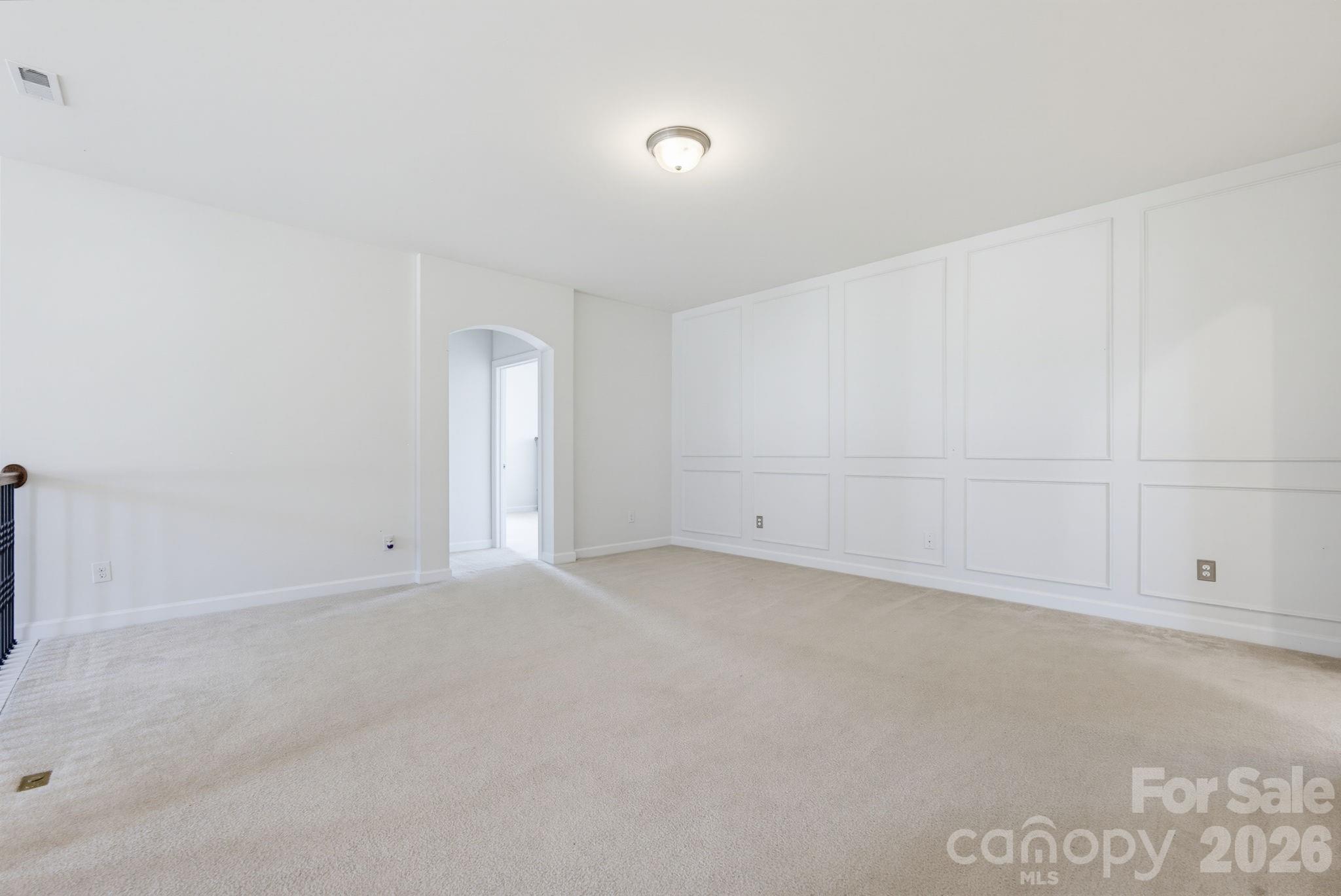 The oversized upstairs loft, featuring classic wainscotting, provides room to grow as your needs change over the years - 8315 Breton Way, Harrisburg