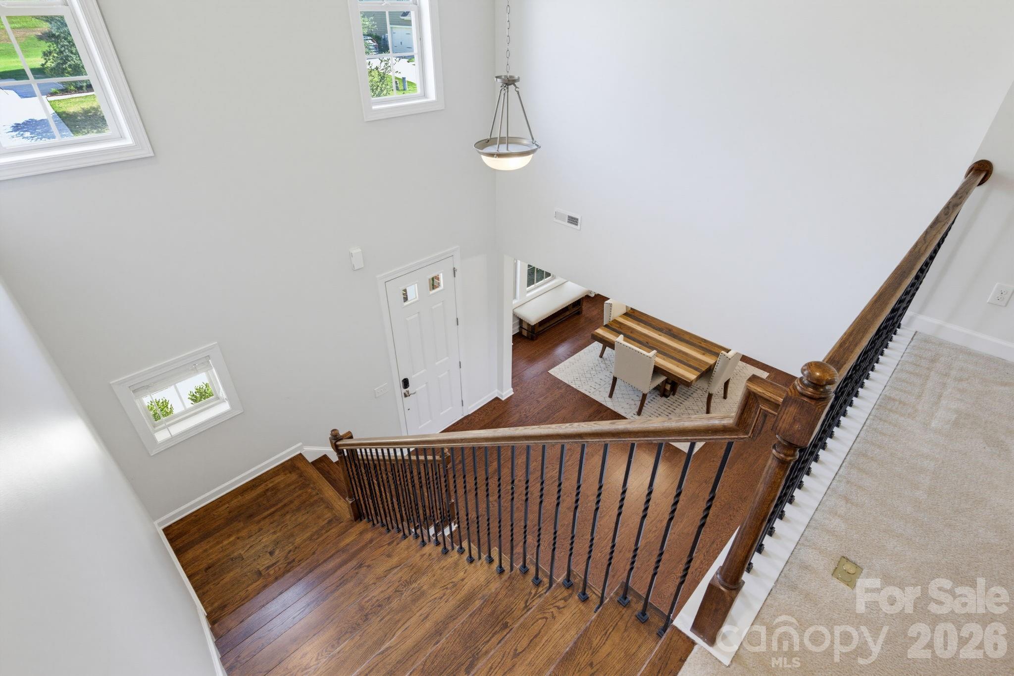 Looking down from the second floor, the dramatic foyer and open staircase reinforce the home's bright, spacious feel. - 8315 Breton Way, Harrisburg