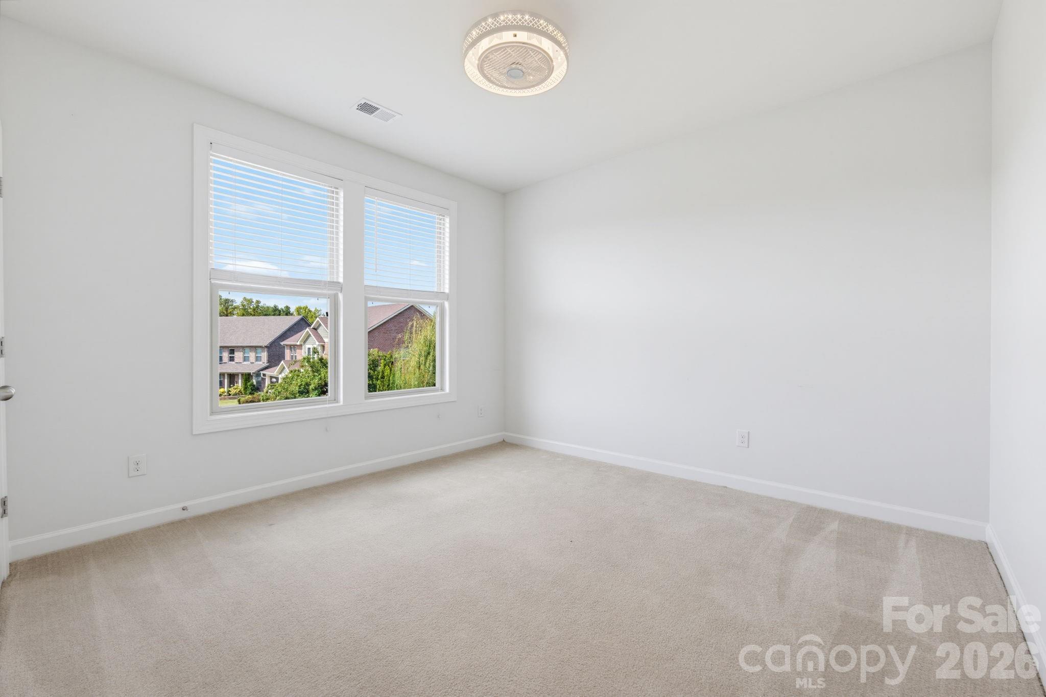 Two generous windows fill this second-level bedroom with natural light, while its comfortable proportions offer plenty of flexibility for sleeping, studying, and making the space entirely your own. - 8315 Breton Way, Harrisburg