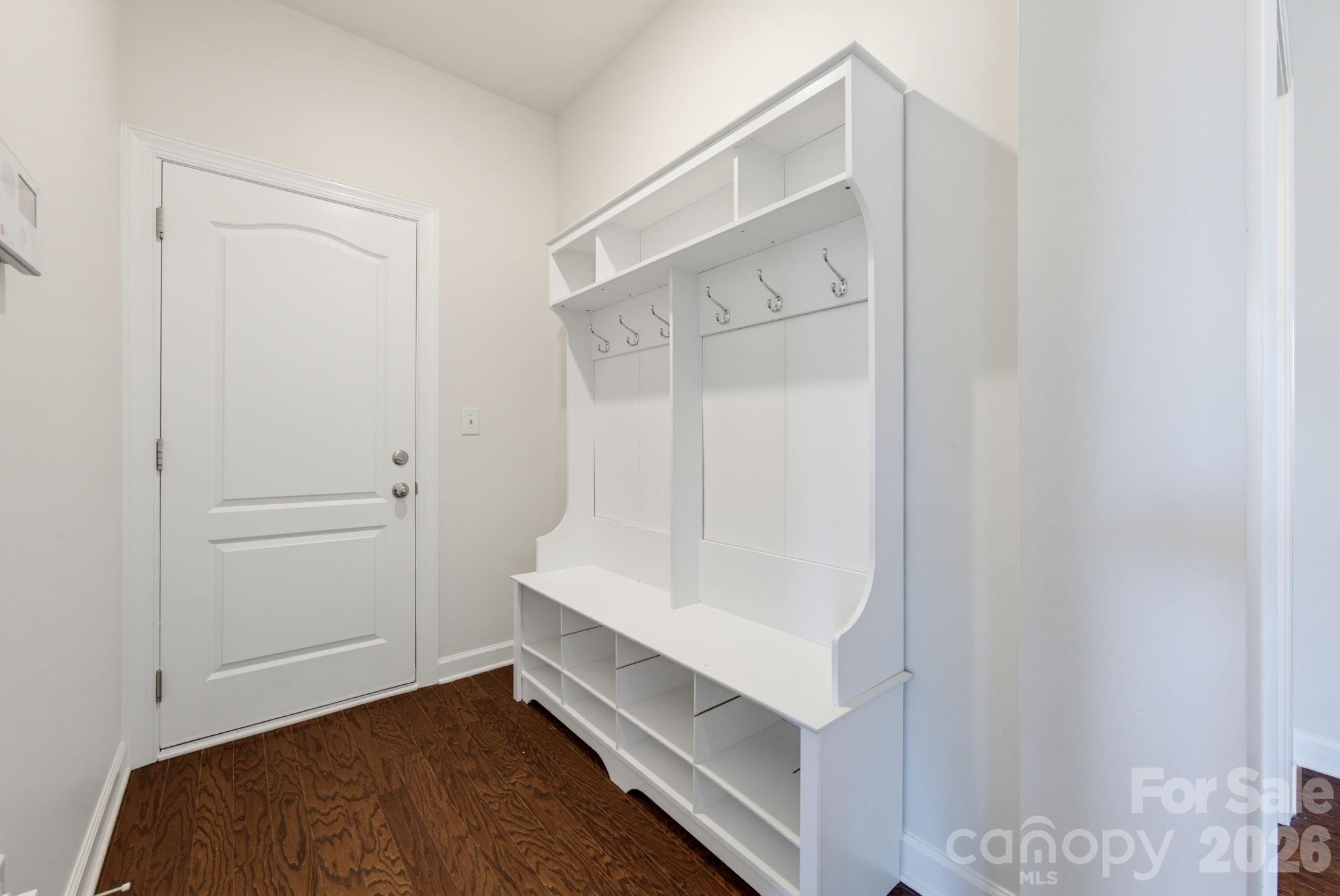 A built-in drop zone near the garage keeps bags, shoes, and everyday essentials organized as everyone comes and goes. - 8315 Breton Way, Harrisburg