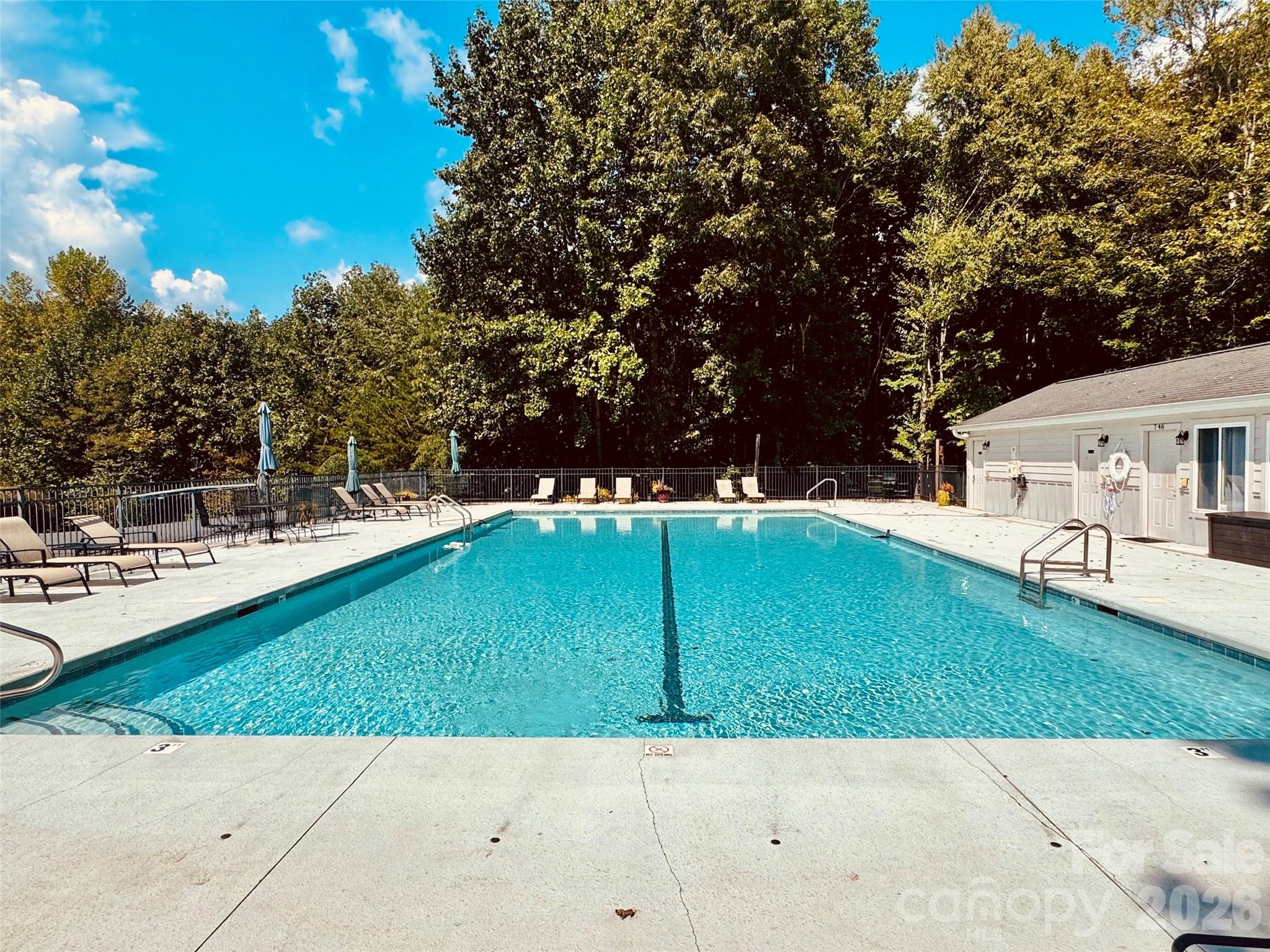 The community pool with cabana and bathrooms with showers - 133 Smokemont Drive, Arden