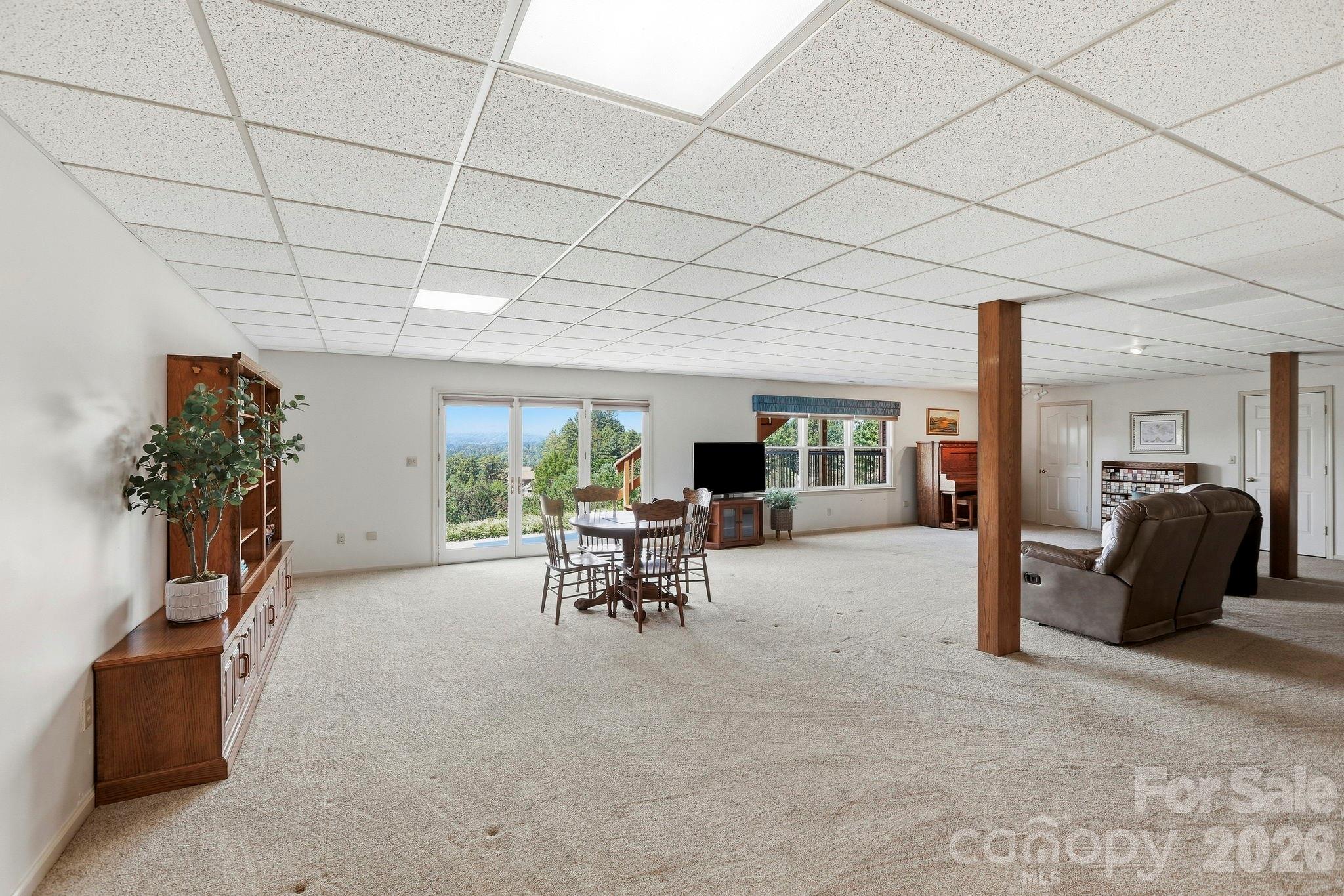 Basement recreation room, the views continue from the lower level! - 244 Mountain Valley Drive, Hendersonville