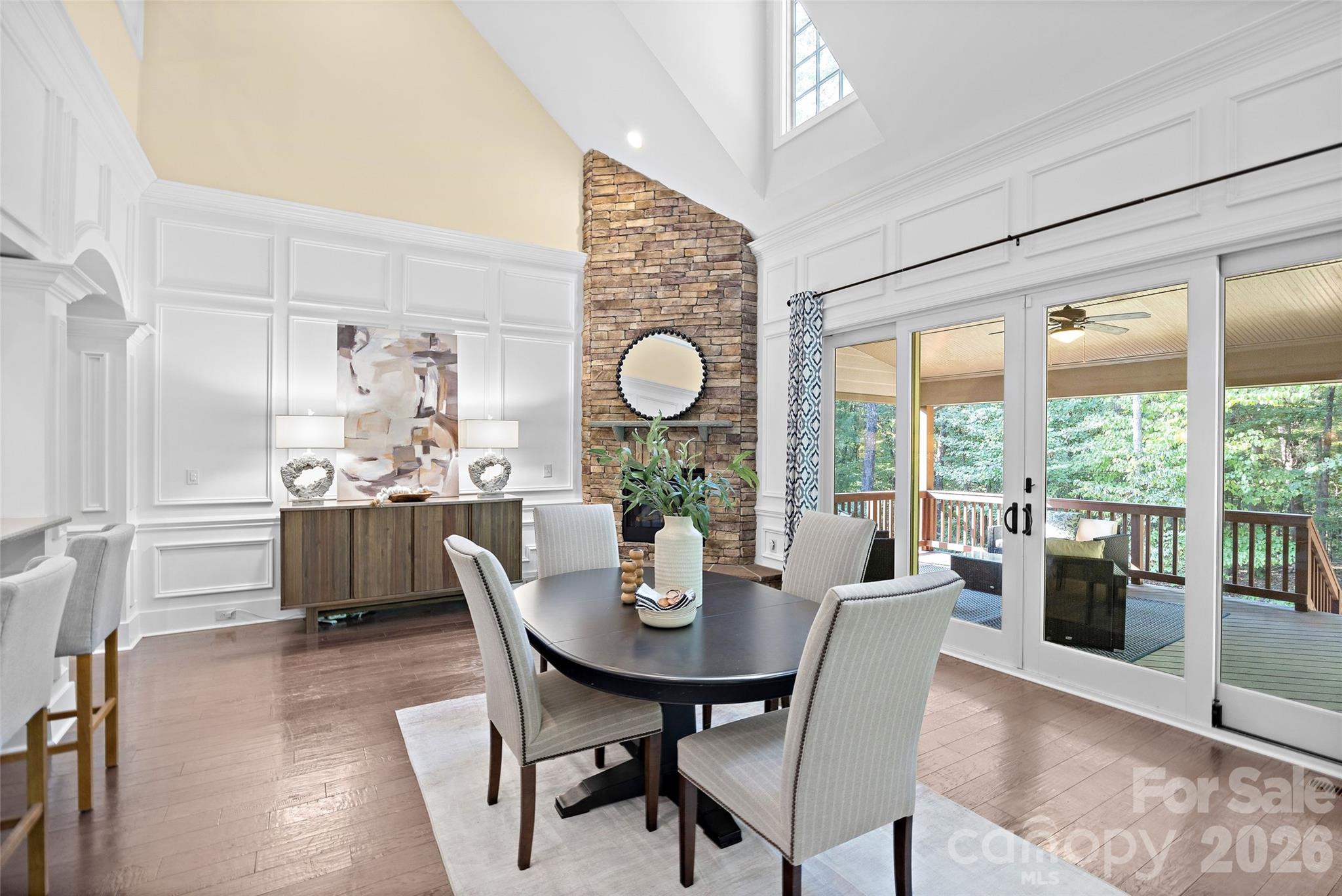 Breakfast area overlooking a beautiful stone wall fireplace - 1623 Hawkstone Drive, Waxhaw