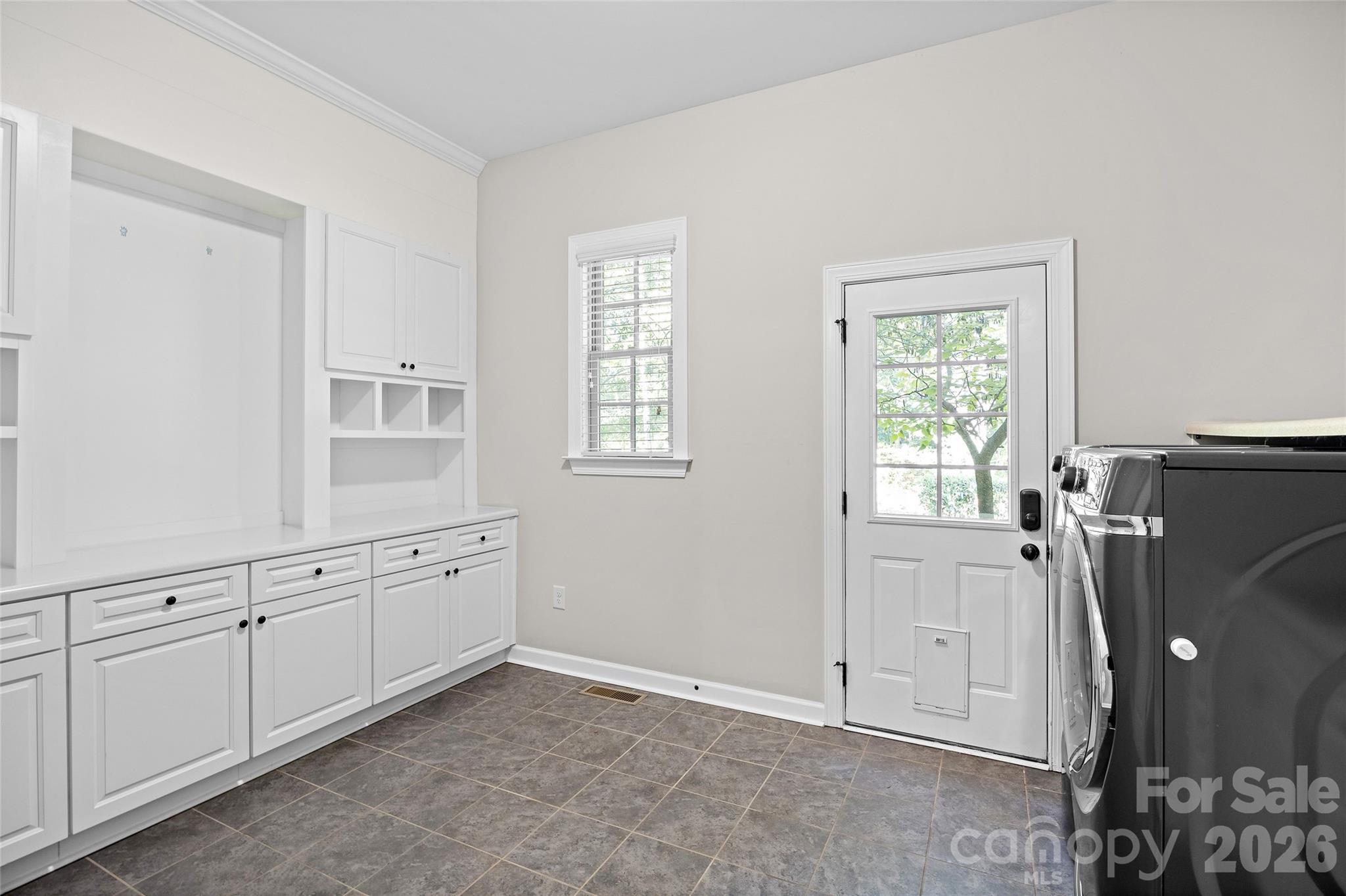 Huge laundry room on the main level - could convert this space into a gorgeous scullery! - 1623 Hawkstone Drive, Waxhaw