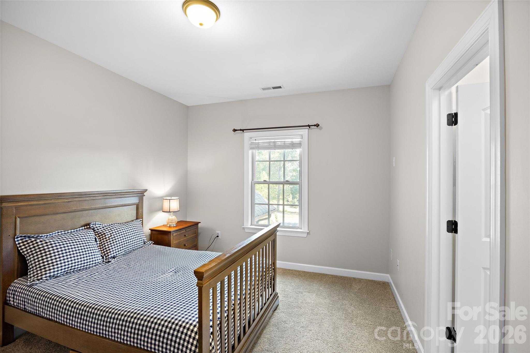 4th bedroom upstairs features a large walk-in closet and ensuite bath - 1623 Hawkstone Drive, Waxhaw