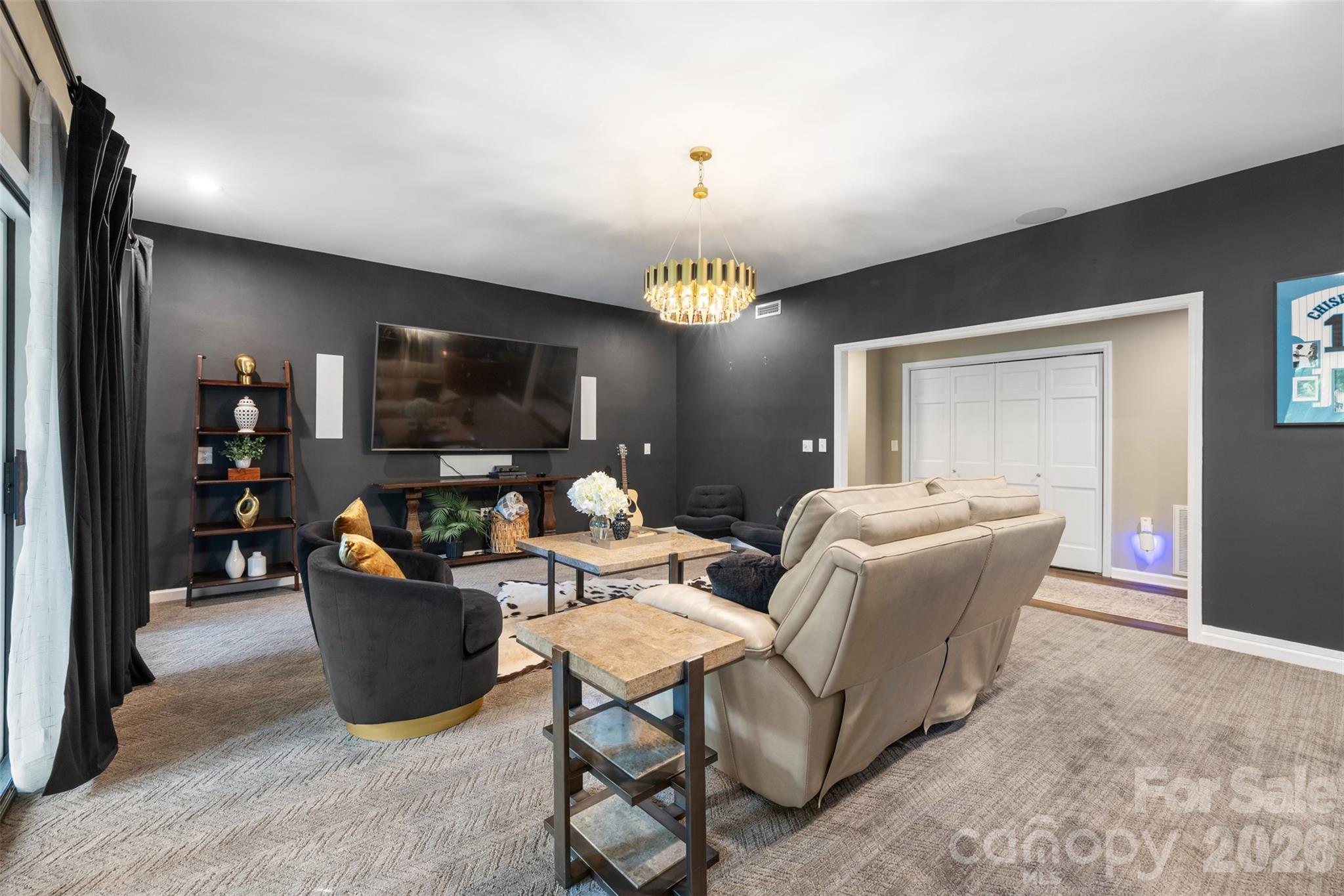 Second living room in lower level offers plush carpeting, black out curtains, wired for surround sound, etc. - 27 Timberidge Drive, Lake Wylie