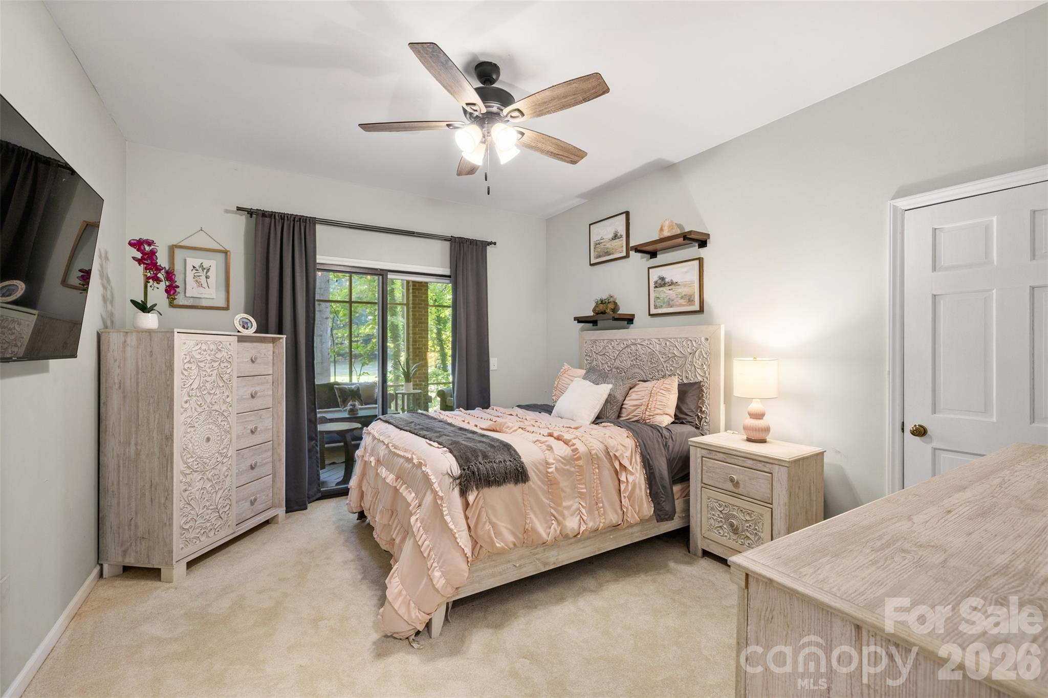 Bedroom 2 in lower level with sliders to the screen porch. - 27 Timberidge Drive, Lake Wylie