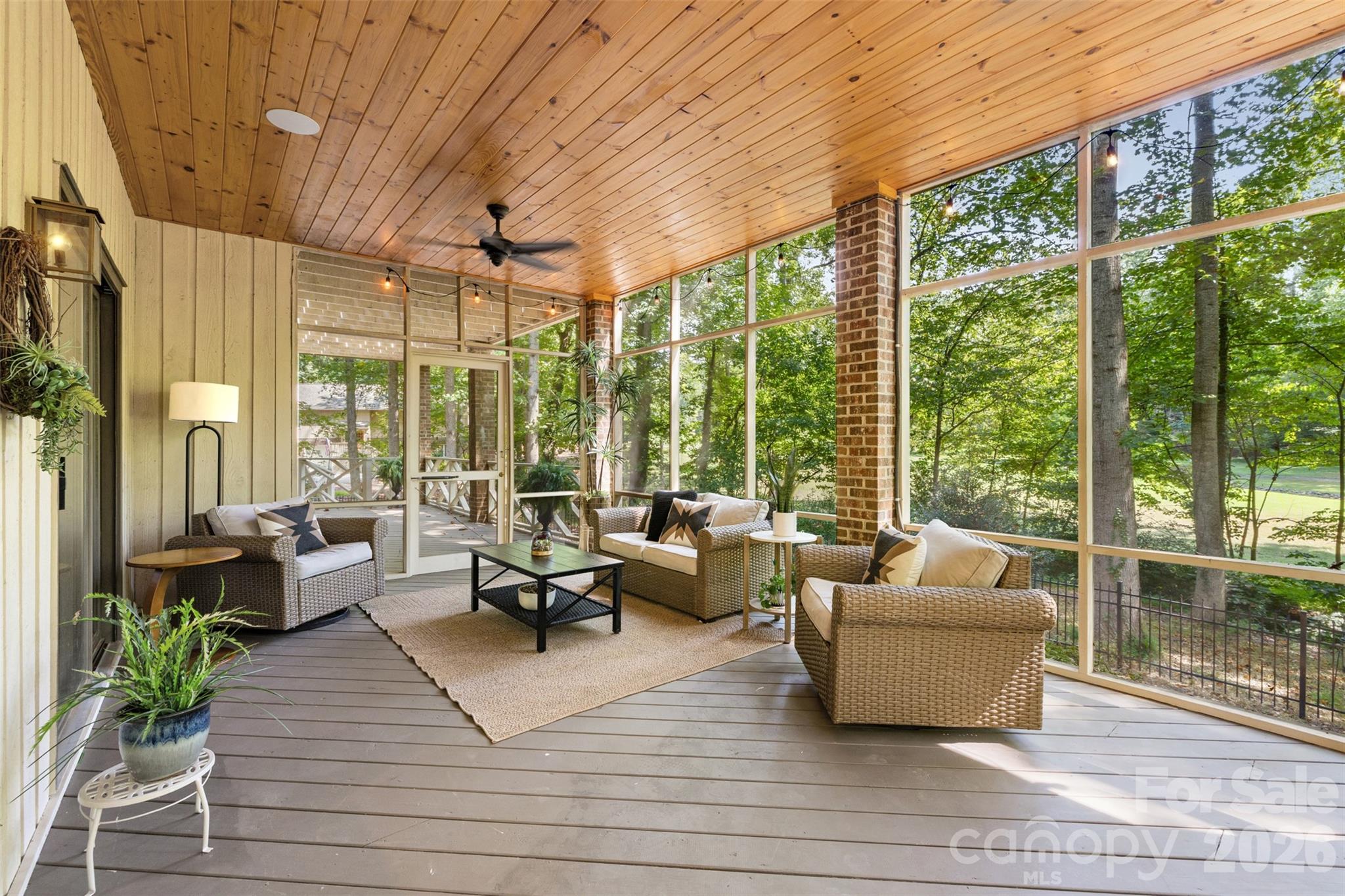 Screened porch opens to deck and private yard - 27 Timberidge Drive, Lake Wylie