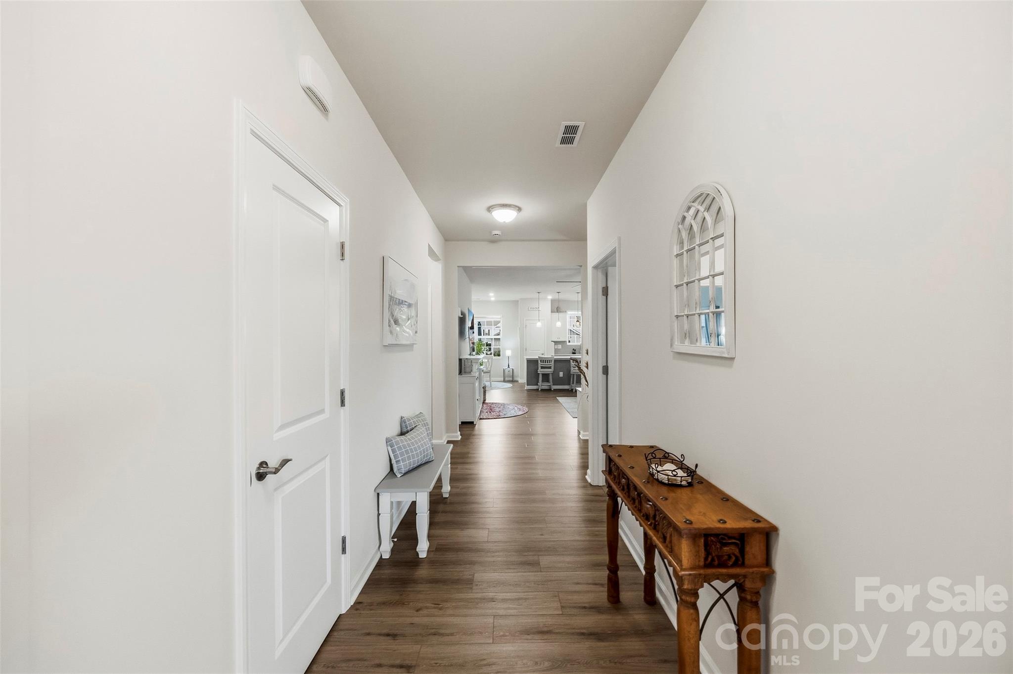 Long Entry hall showing coat closet to the left, kitchen at the end. - 1734 Otter Perch Lane, Fort Mill