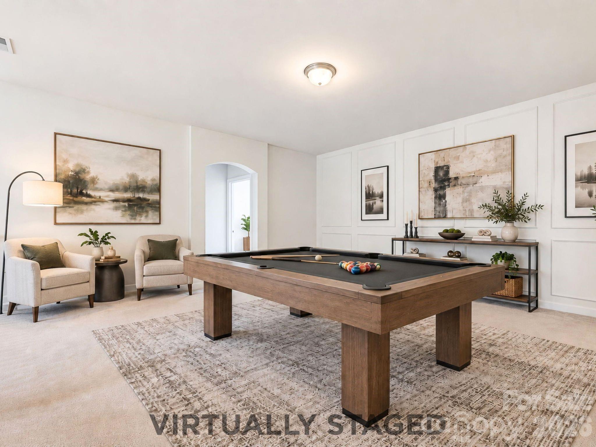 Virtually staged as a game room, the second-level loft offers the flexibility to become a media space, home office, playroom, or an additional relaxed gathering space - 8315 Breton Way, Harrisburg