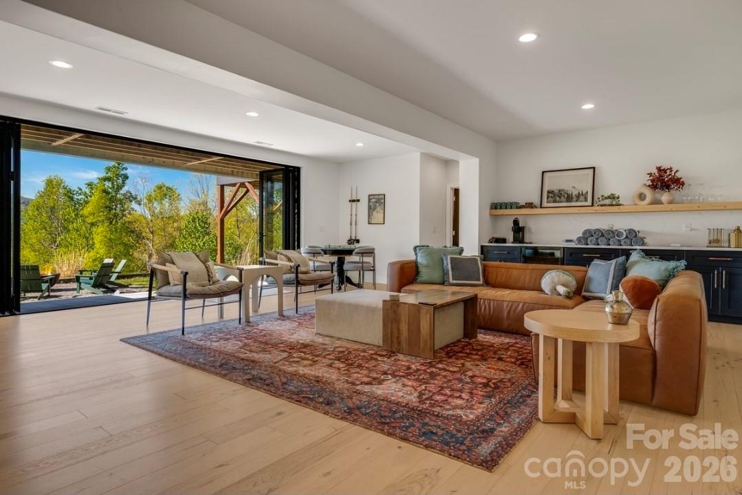 Lower Level Living Area w Accordion Sliding Glass Doors - 58 Bird Creek Estates Road, Black Mountain