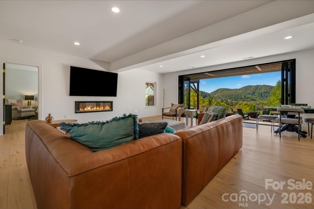 Lower Level Living Area w Accordion Sliding Glass Doors - 58 Bird Creek Estates Road, Black Mountain
