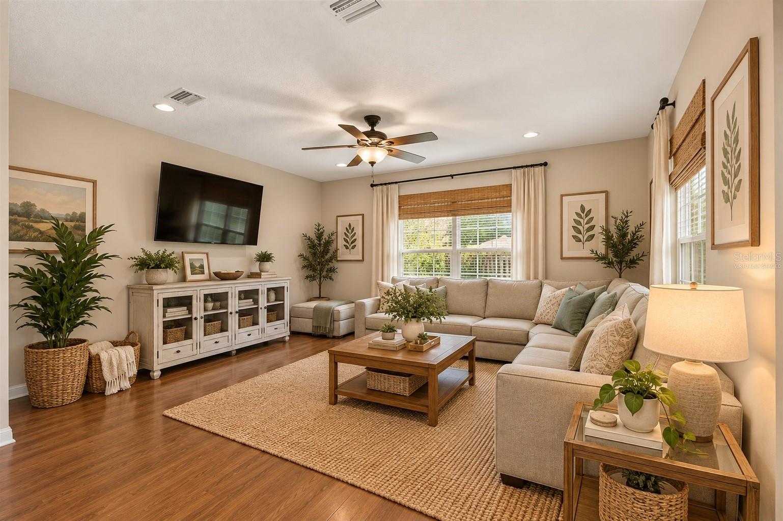 Virtually staged family room off kitchen with views of backyard - 6618 SW 83RD TER, GAINESVILLE