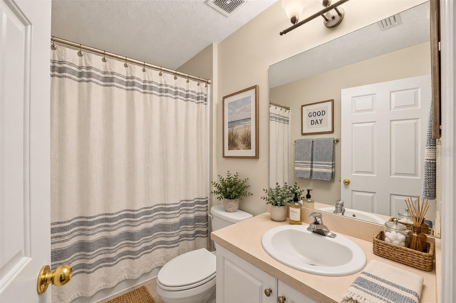 One of three full bathrooms, virtually staged - 6618 SW 83RD TER, GAINESVILLE