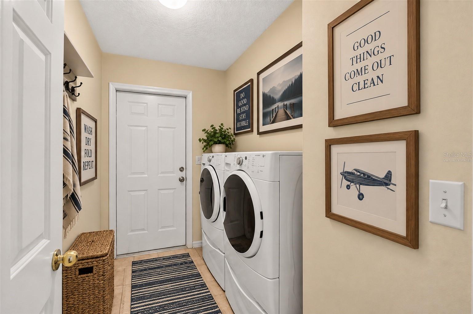 Laundry leading to garage, virtually staged - 6618 SW 83RD TER, GAINESVILLE
