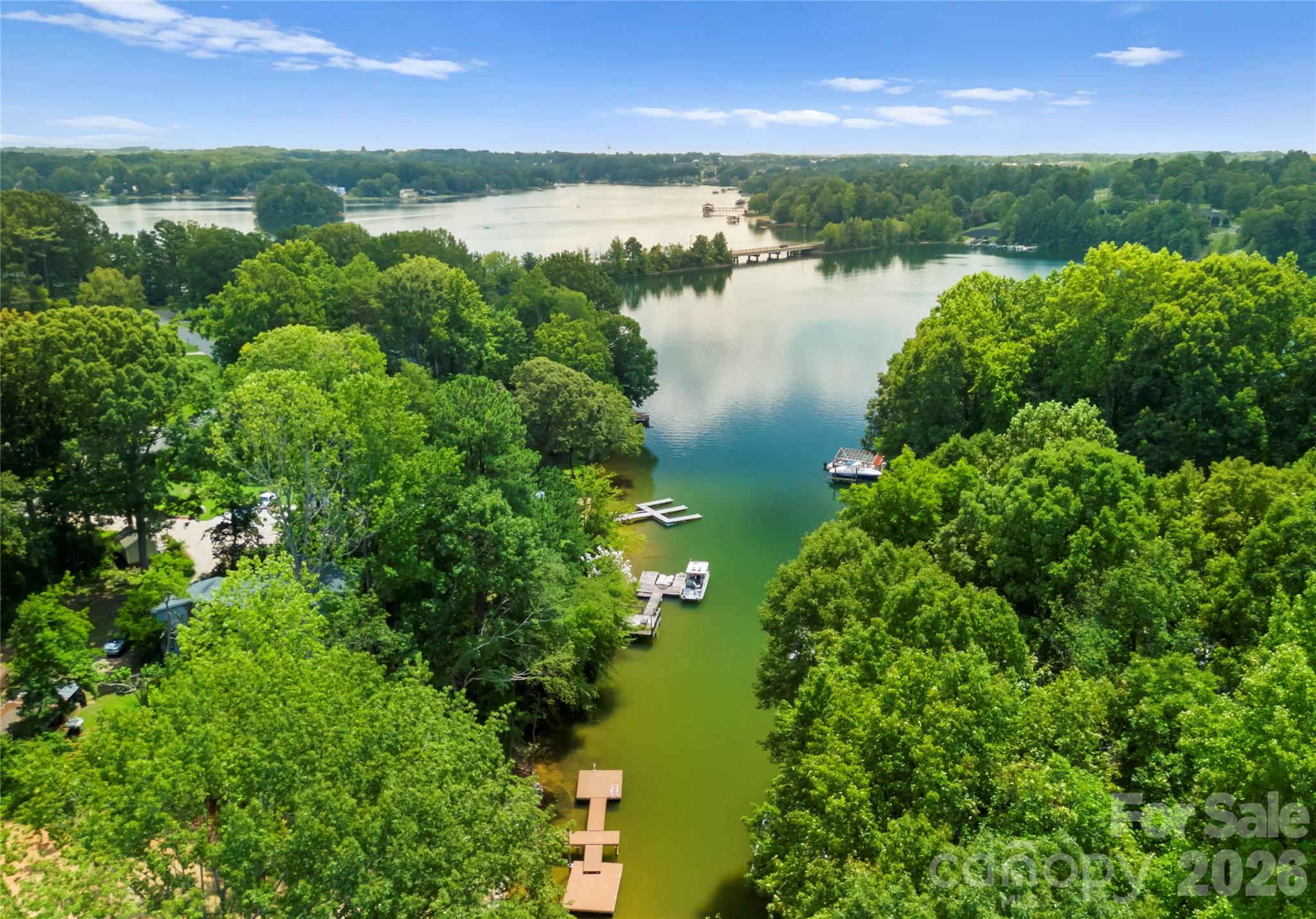 Tucked along a wooded cove, the property offers a peaceful waterfront setting with the open waters of Lake Norman just beyond. - 143 Hideaway Lane, Mooresville