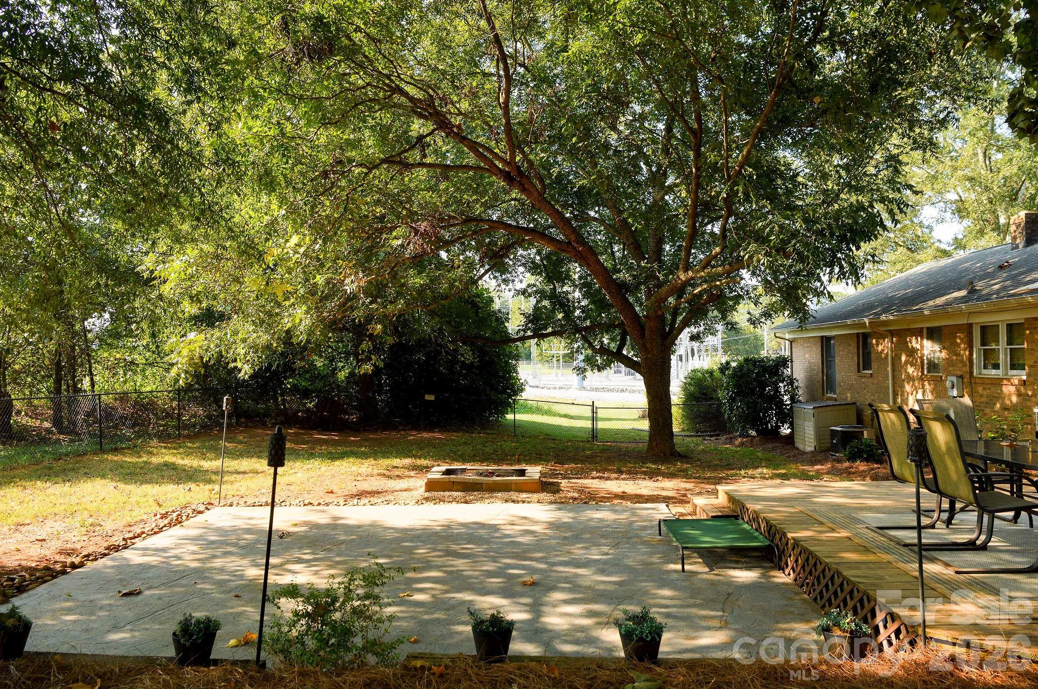 Concrete pad and a fire pit complete this great back yard! - 3910 Fallston Road, Shelby