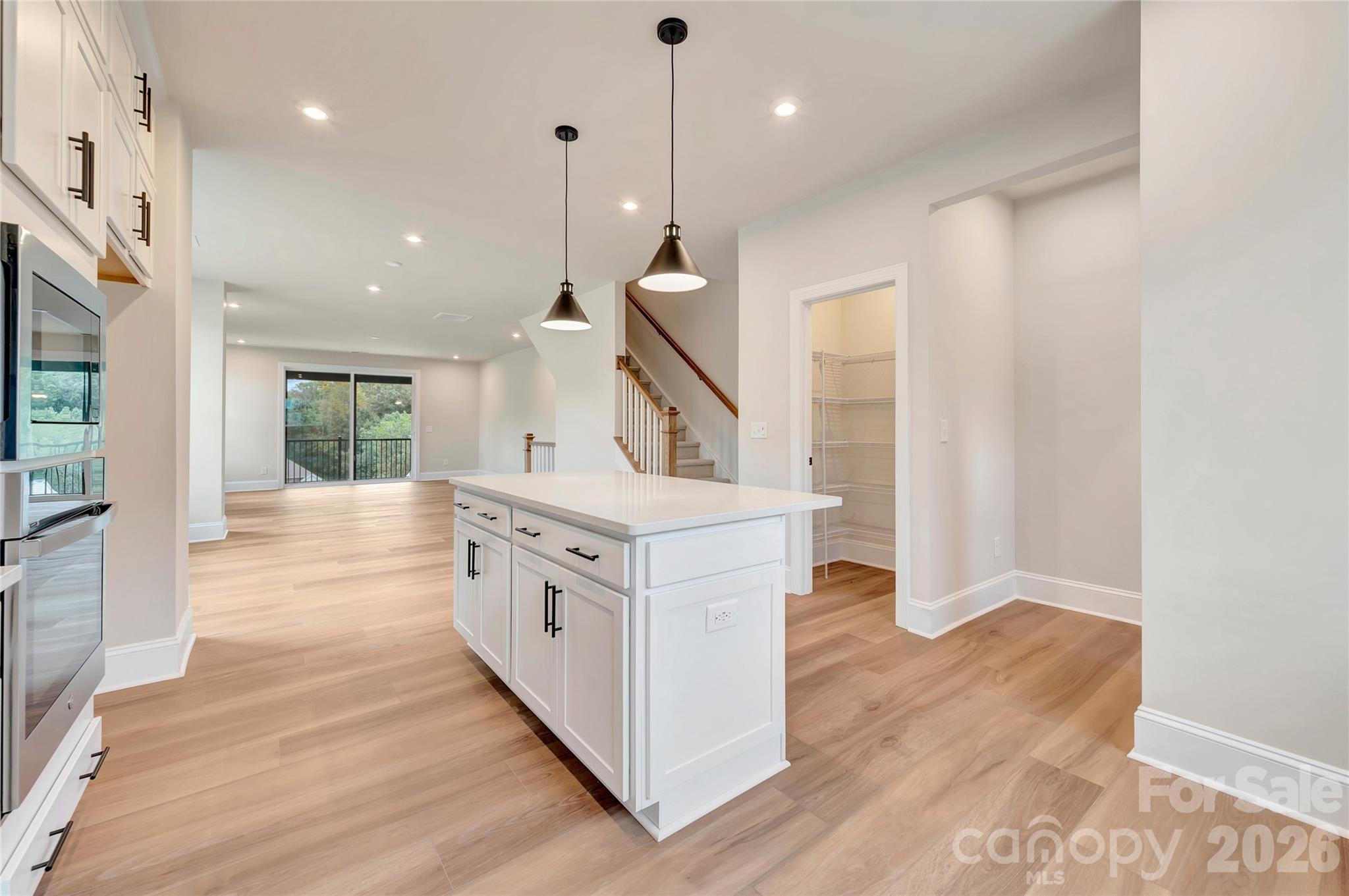Gourmet kitchen with island and a walk-in pantry - 444 Old Town Village Road, Waxhaw