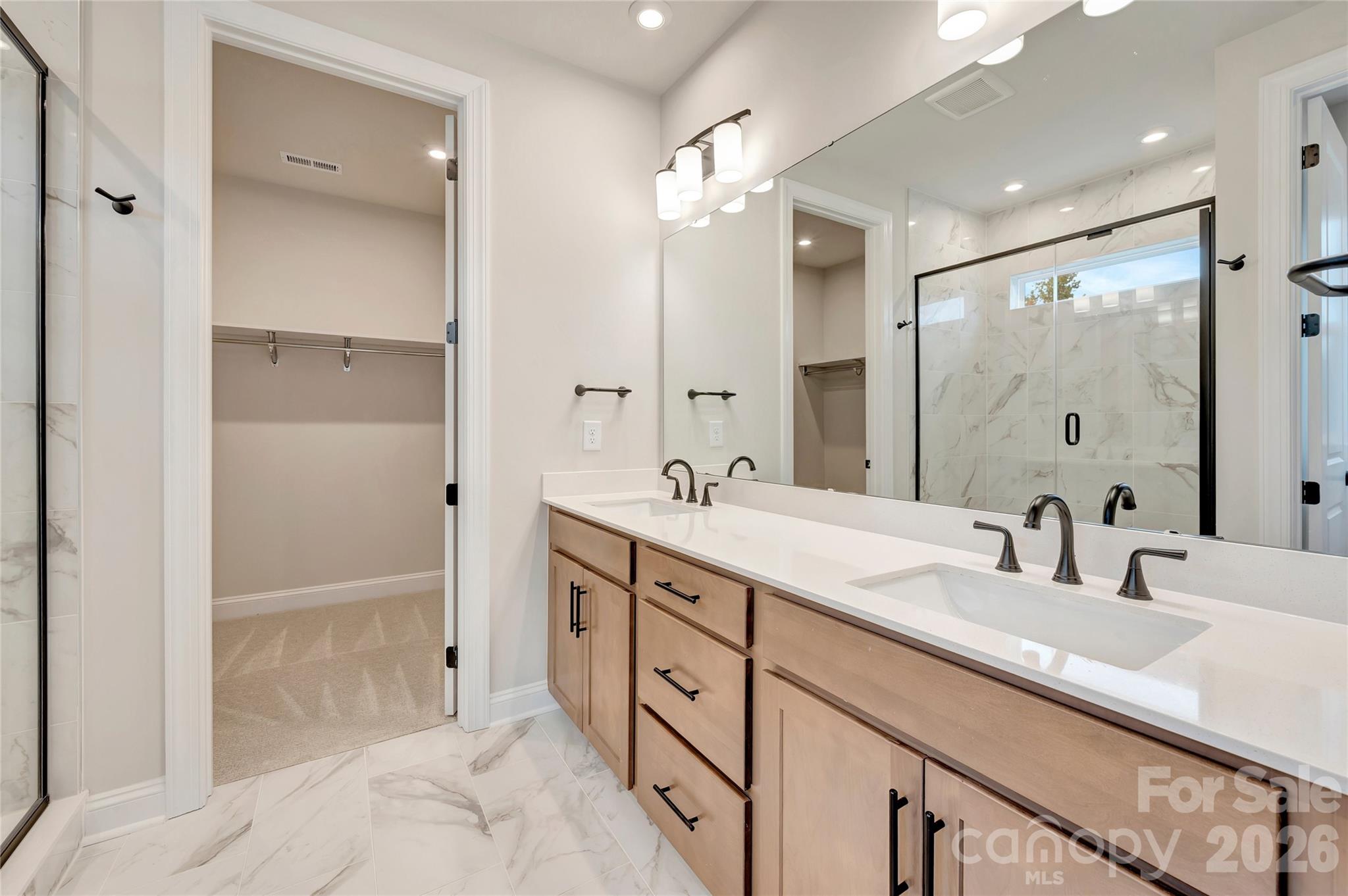Primary dual vanity bathroom with a walk-in closet - 444 Old Town Village Road, Waxhaw