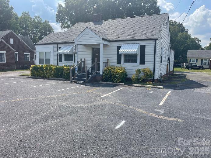 Street View with parking places (4) - entire lot is paved around the business - 1670 Dale Earnhardt Boulevard, Kannapolis