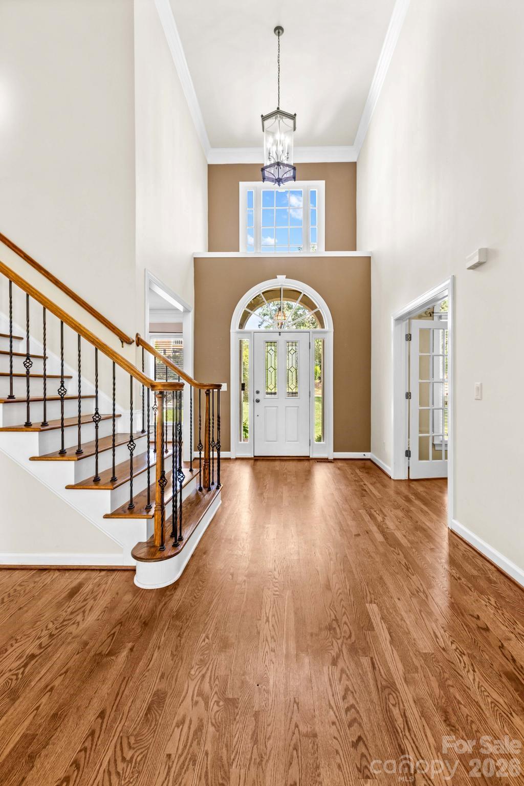 Grand two-story foyer with gleaming hardwoods welcome you into the home. - 12822 Cadgwith Cove Drive, Huntersville
