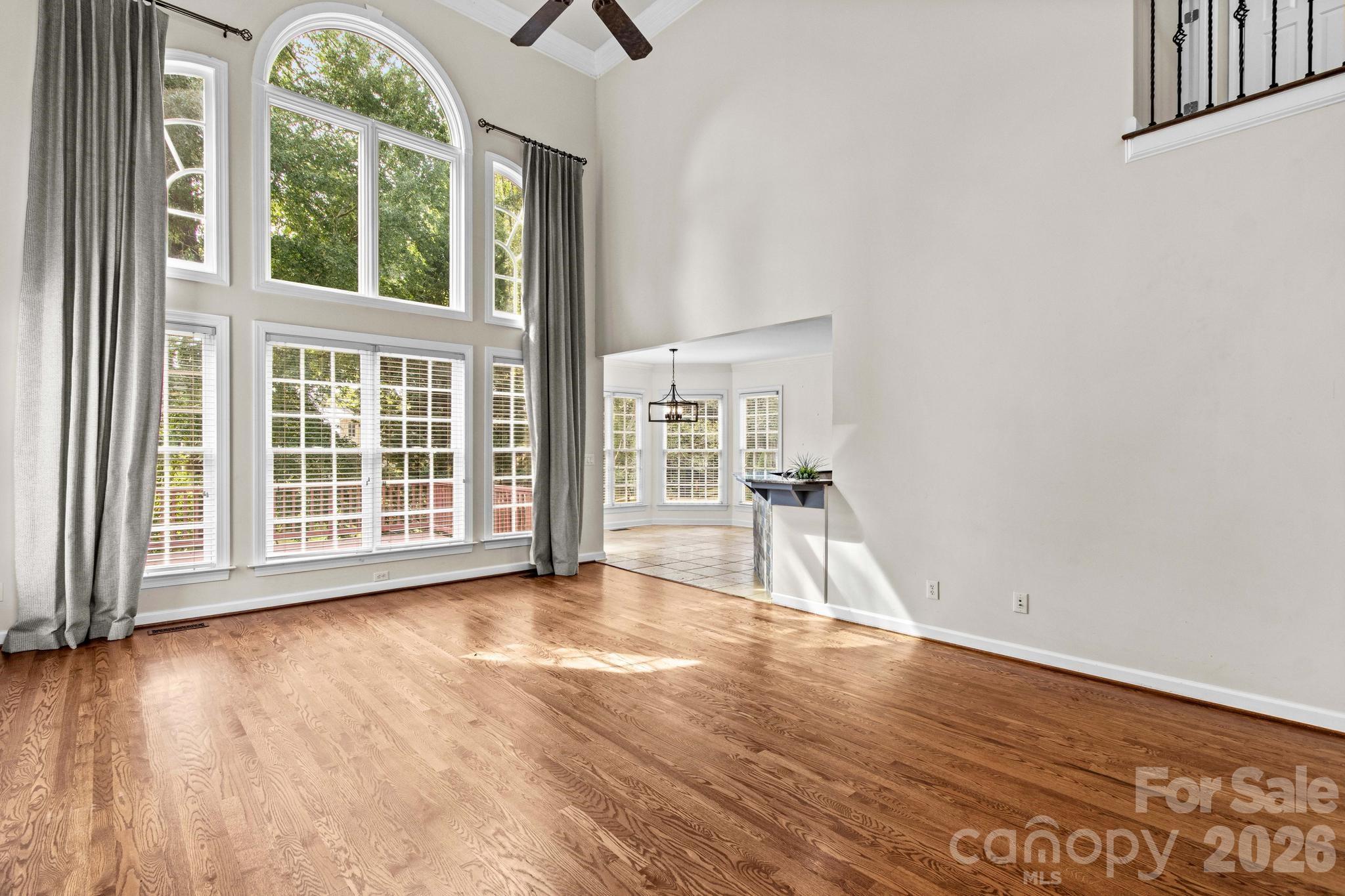 Wall of windows in the great room provide tons of natural light. - 12822 Cadgwith Cove Drive, Huntersville