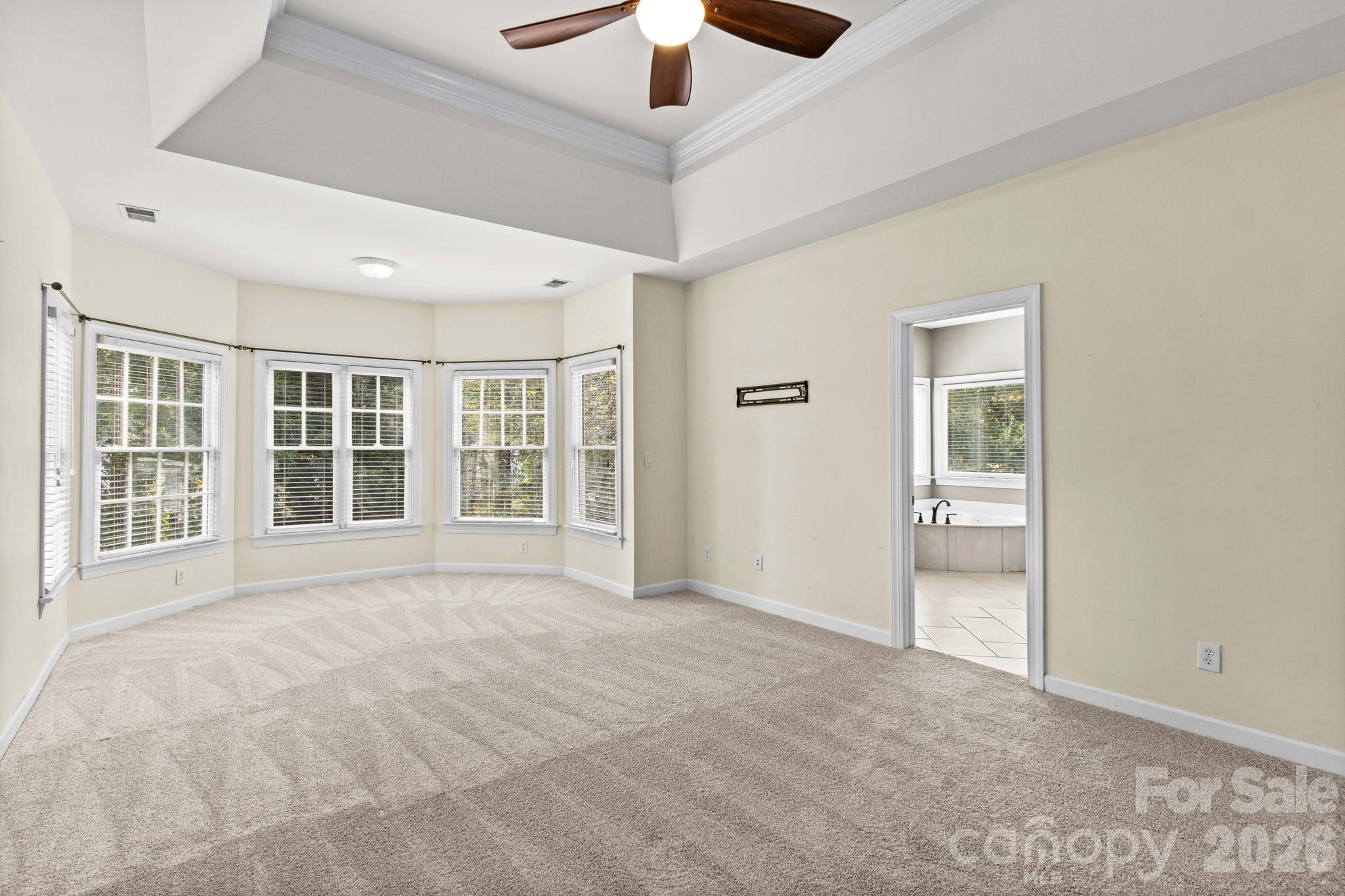 Spacious primary bedroom with a sitting area is located on second floor. - 12822 Cadgwith Cove Drive, Huntersville