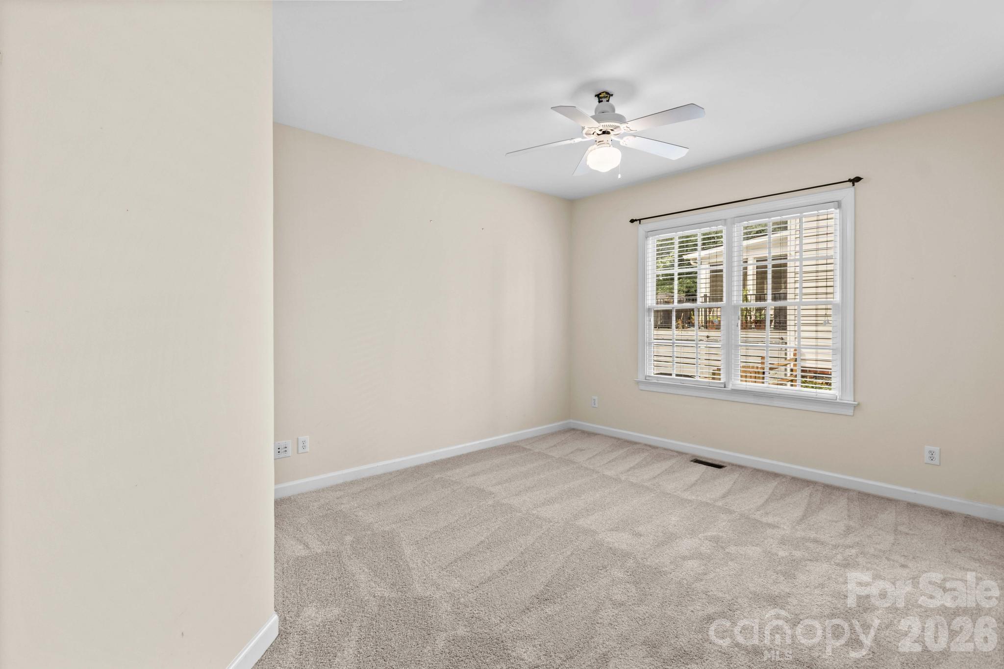 Main level ensuite bedroom #5 is ideal for overnight guests needing their own space. - 12822 Cadgwith Cove Drive, Huntersville