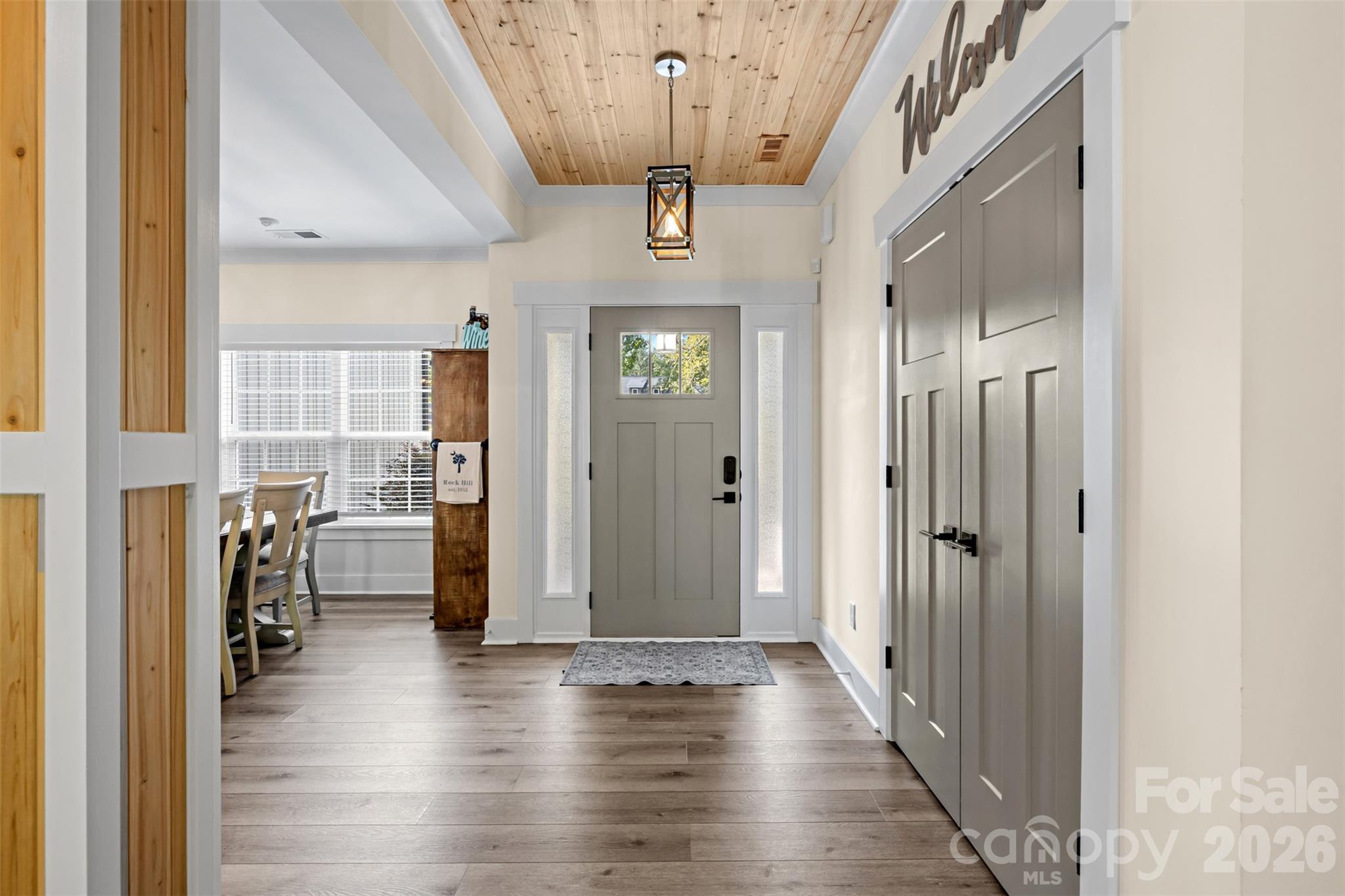 Bright entryway with custom details and warm wood accents - 1604 Aragon Beach Road, Rock Hill