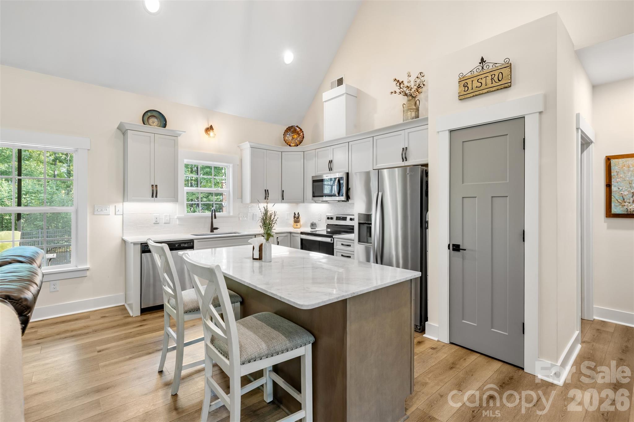 Open-concept design keeps the kitchen connected to the living spaces - 1604 Aragon Beach Road, Rock Hill