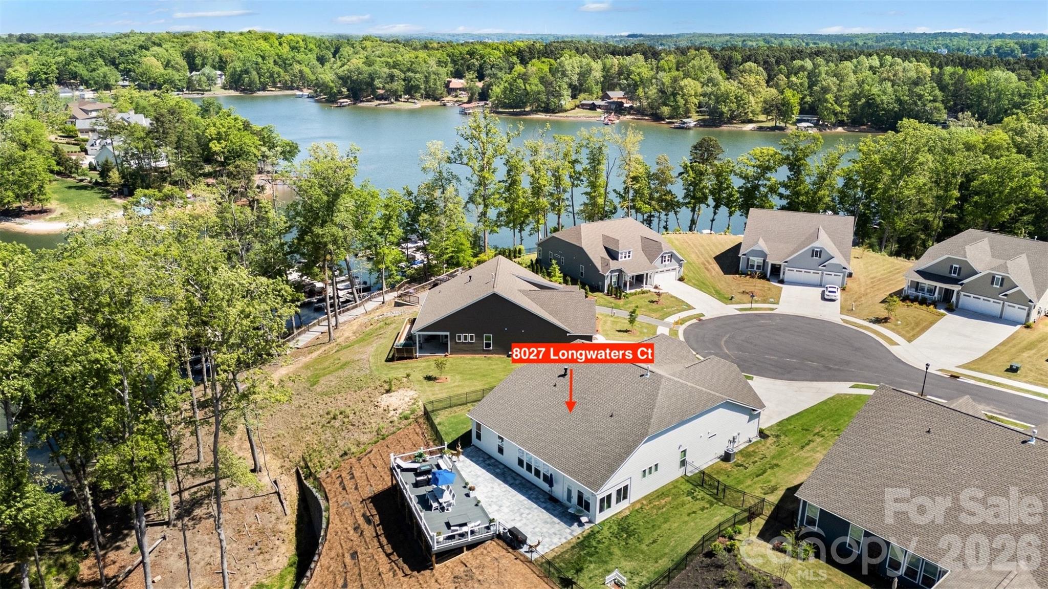Cul-de-sac lot, fenced yard, big deck, and Lake Wylie just beyond the trees. - 8027 Longwaters Court, York