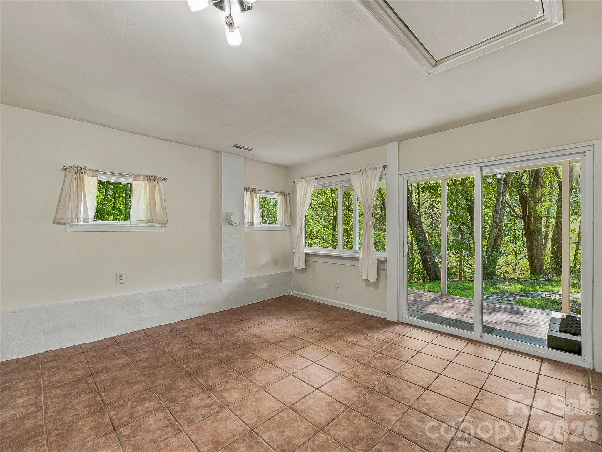 tiled sunroom off kitchen - 65 Passional Way, Burnsville
