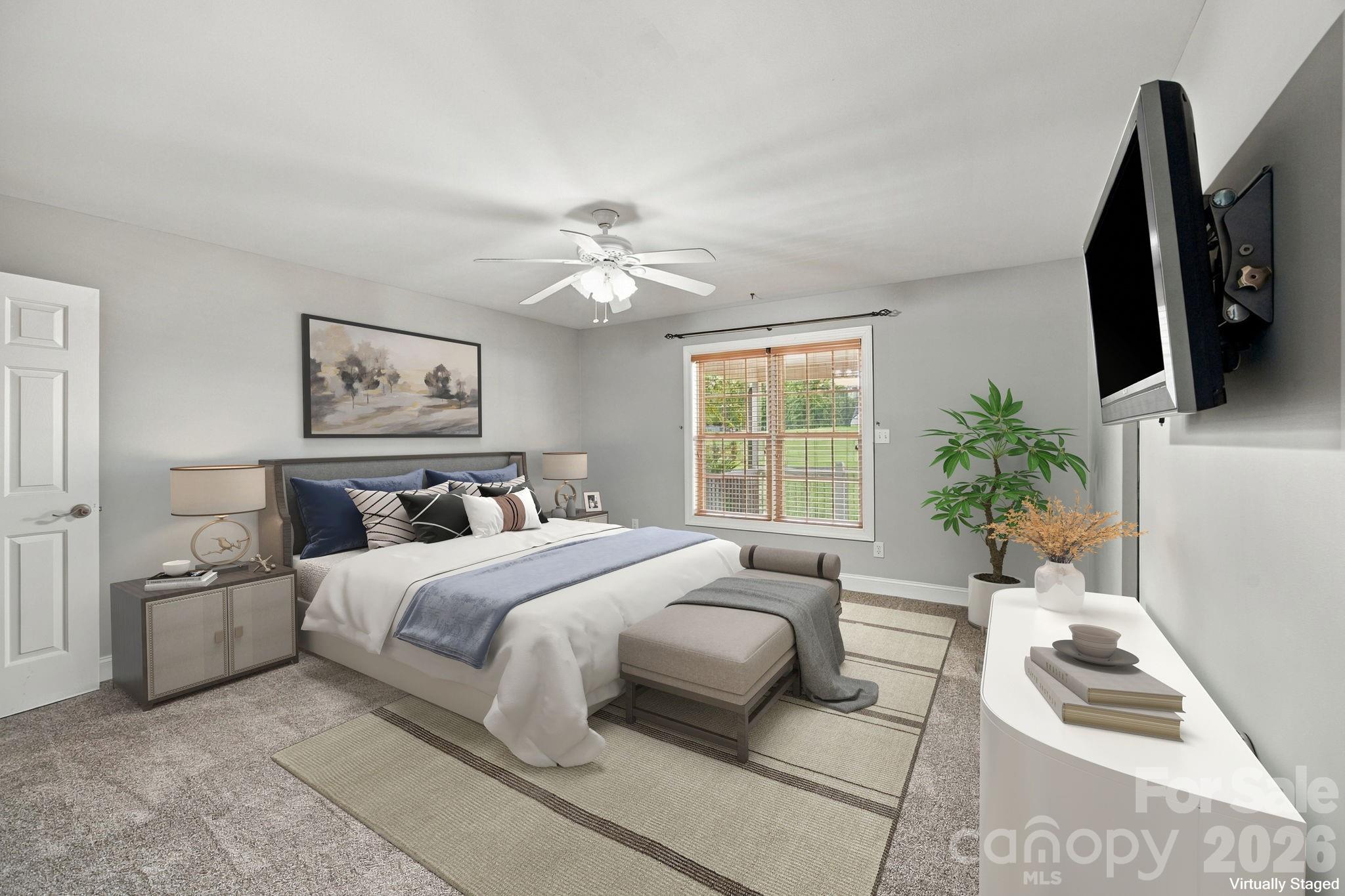 Virtually staged to showcase the size and possibilities of the main-level primary bedroom. - 122 Wood Duck Loop, Mooresville