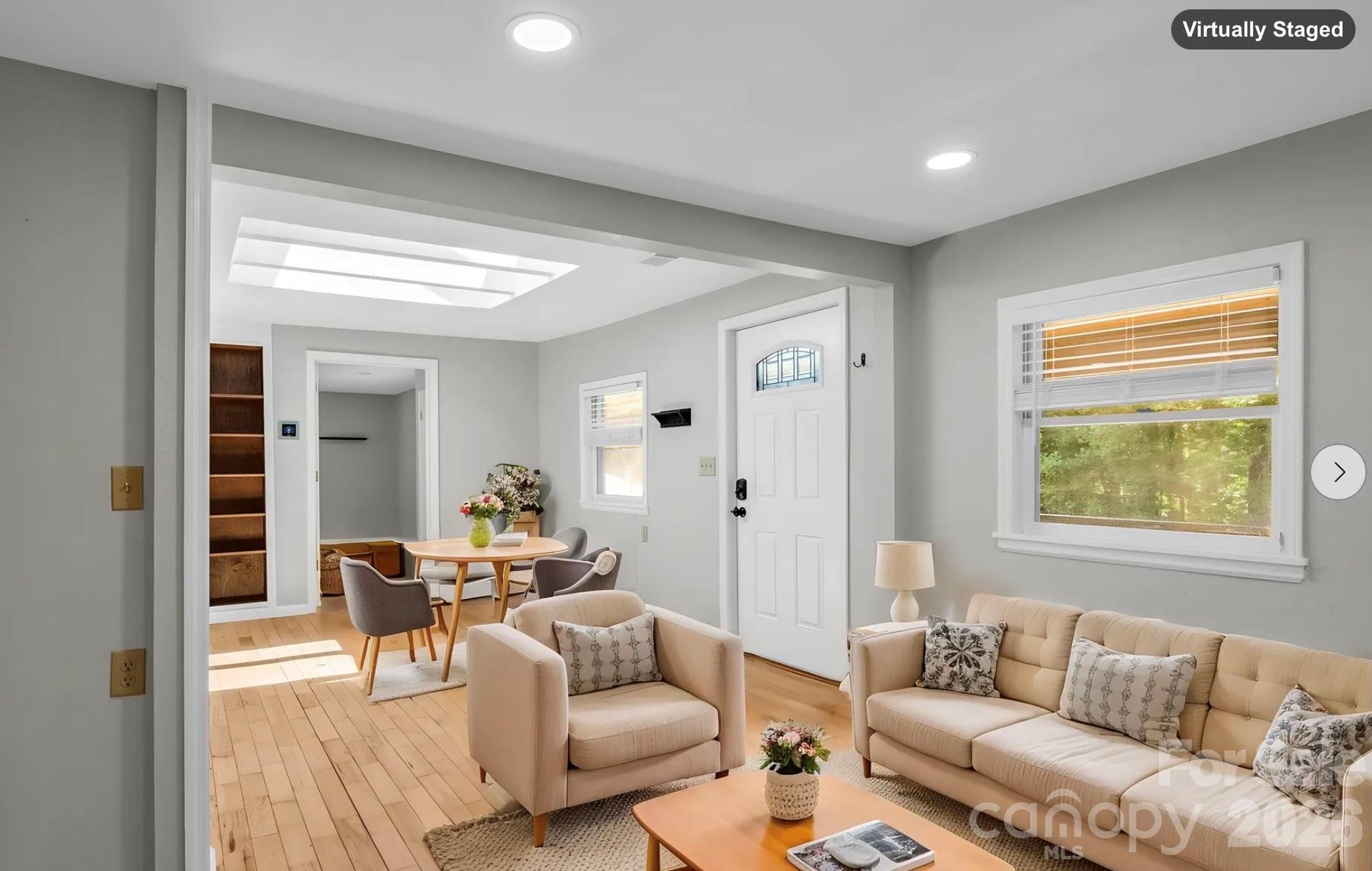 Dining Room, facing toward Living Room & door opening to Family Room (virtually staged) - 35 Chastain Hill Road, Mills River