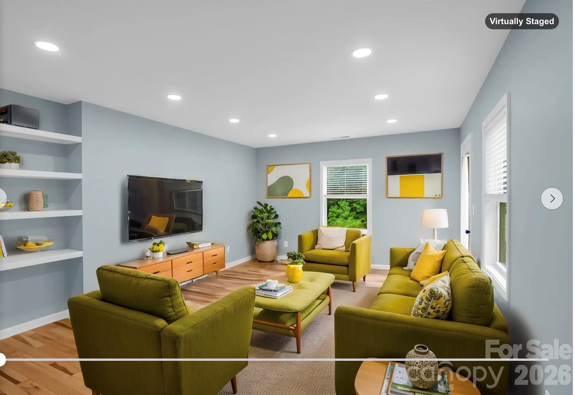 *virtually staged as Den - Config A* Dedicated office/private den off of the primary bedroom with door to back yard - 35 Chastain Hill Road, Mills River