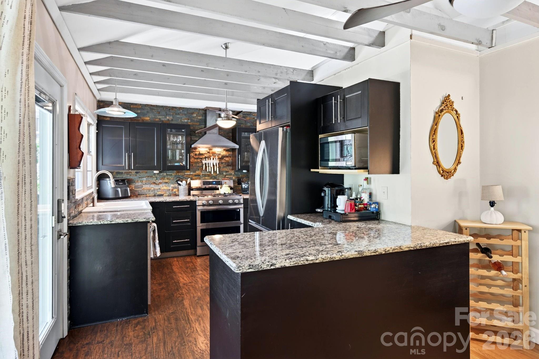 Abundant cabinetry, granite counters and stainless appliances - 109 Wilshire Drive, Asheville