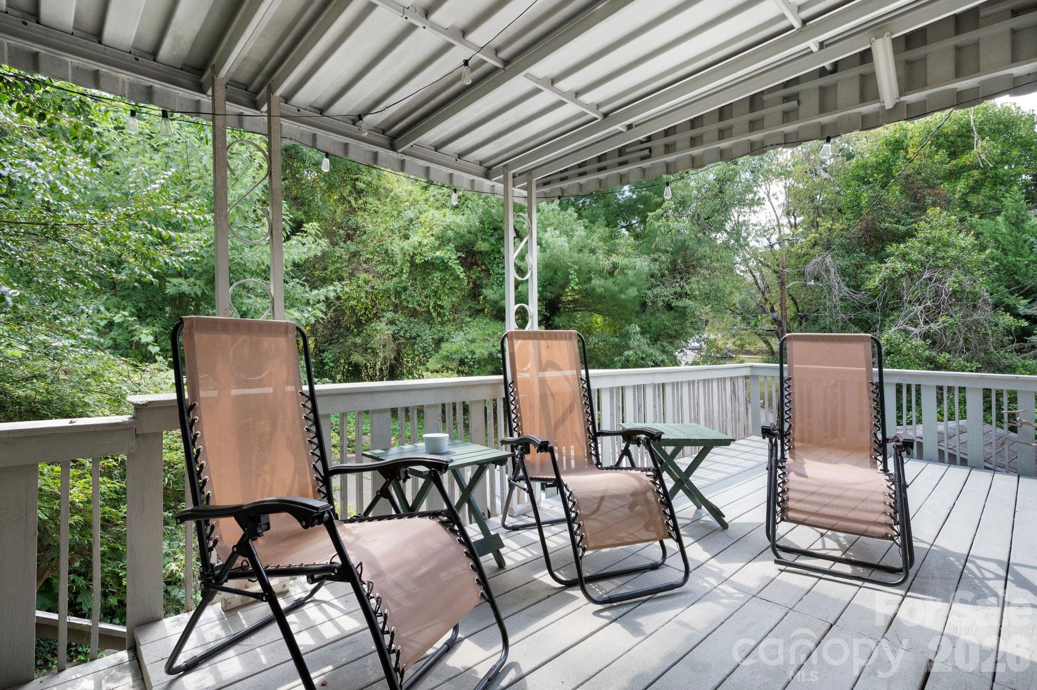 Relax outside on the covered deck - 109 Wilshire Drive, Asheville