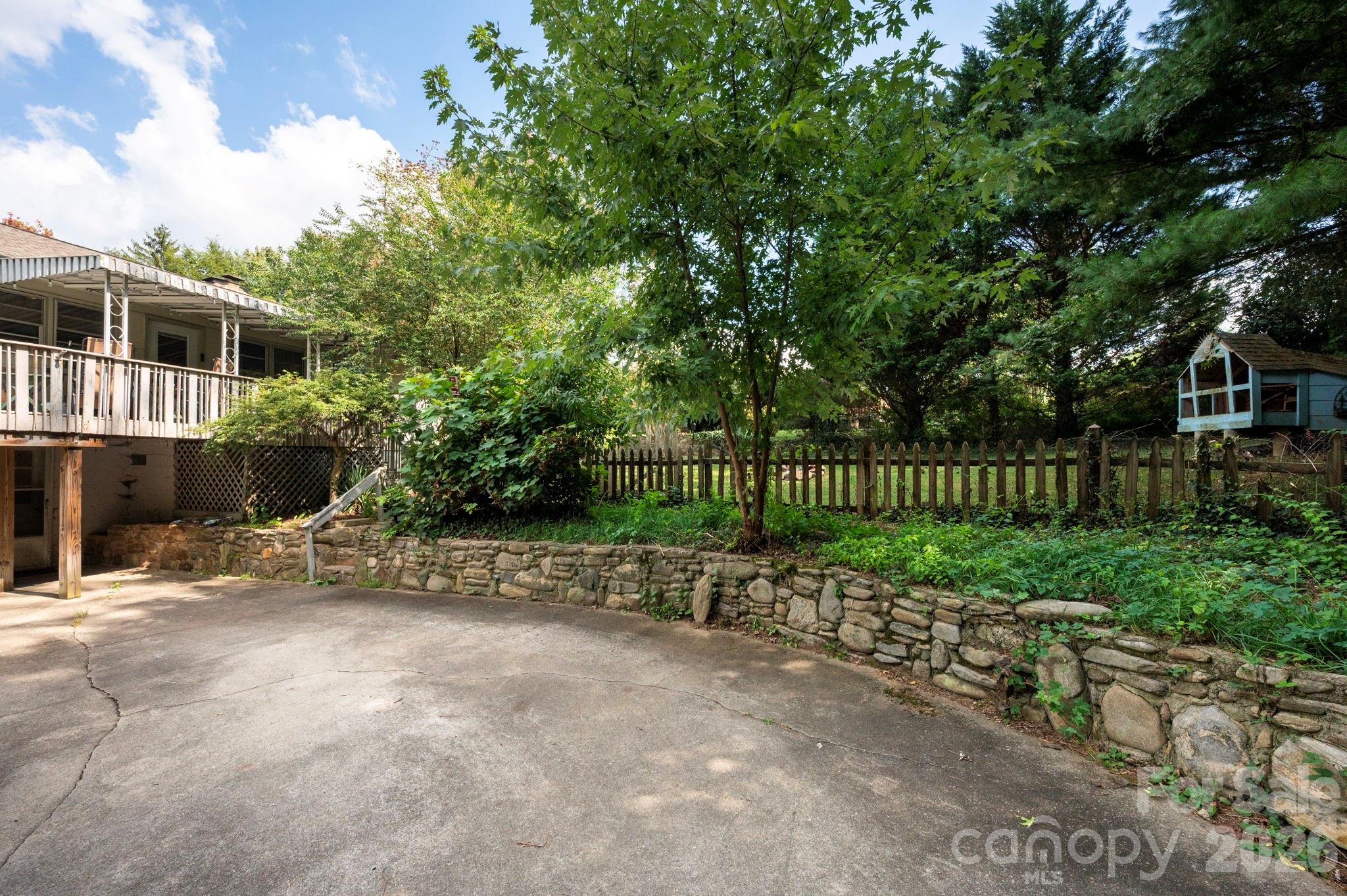 Large concrete driveway edged by beautiful stonewall - 109 Wilshire Drive, Asheville