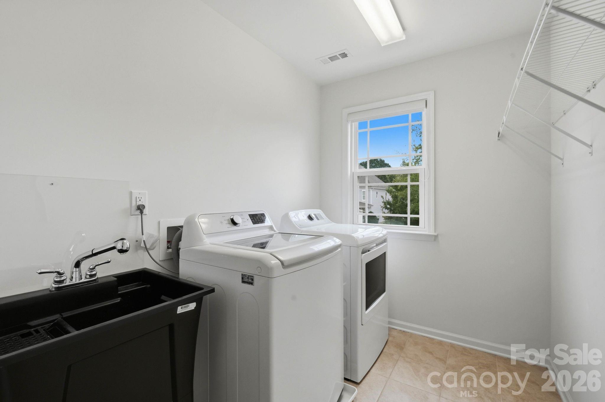 Upper Level Laundry Room with utility sink - 108 Heron Cove Loop, Mooresville