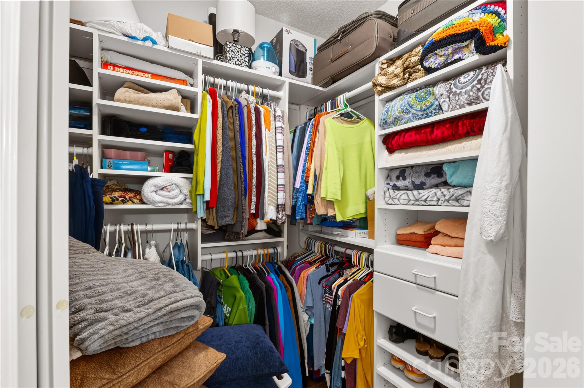Custom closet with lots of shelving and built-in drawers - 165 Ewbank Garden Drive, Hendersonville