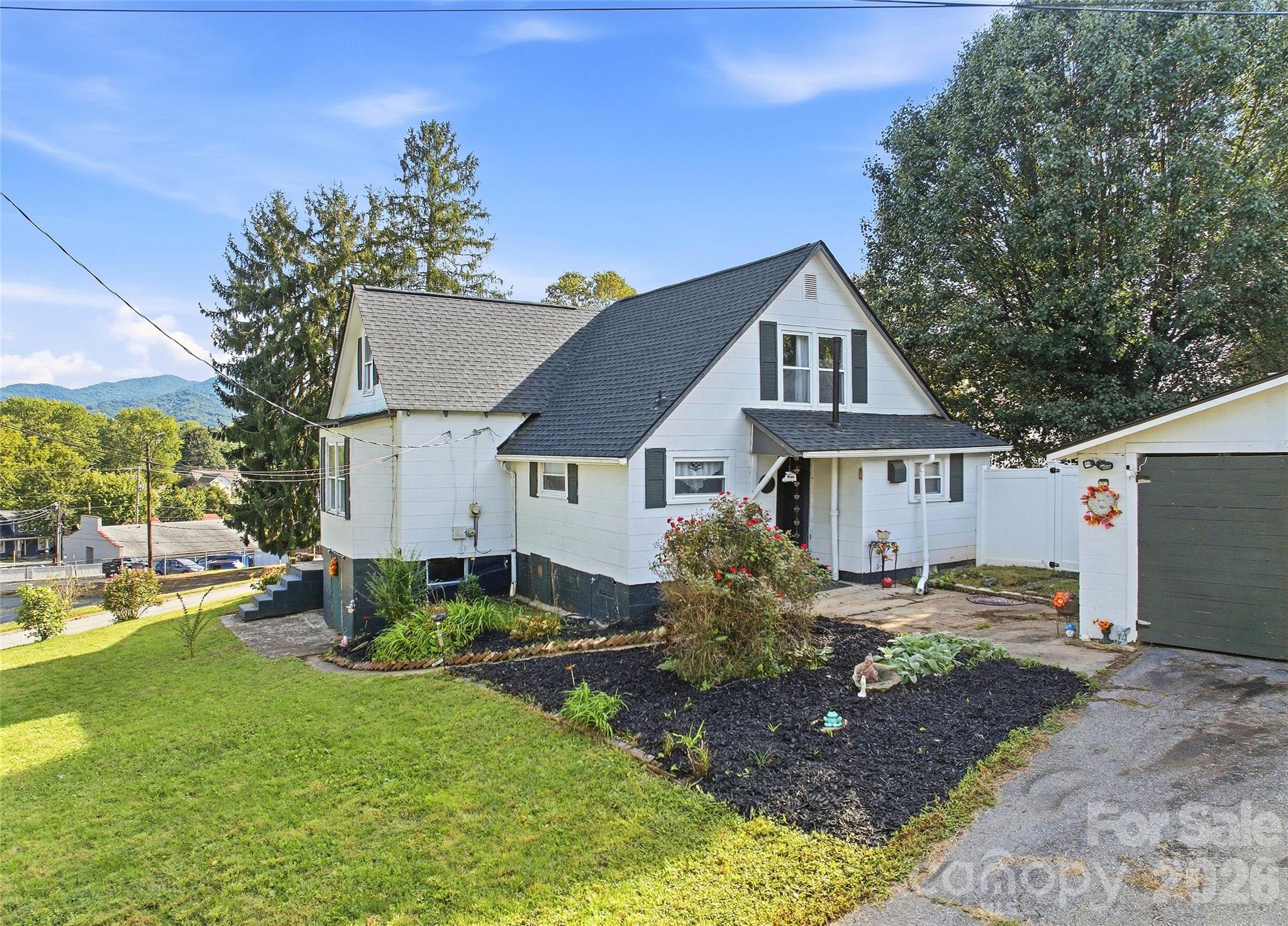Driveway leading to 2+ garage. - 159 Ballew Street, Canton