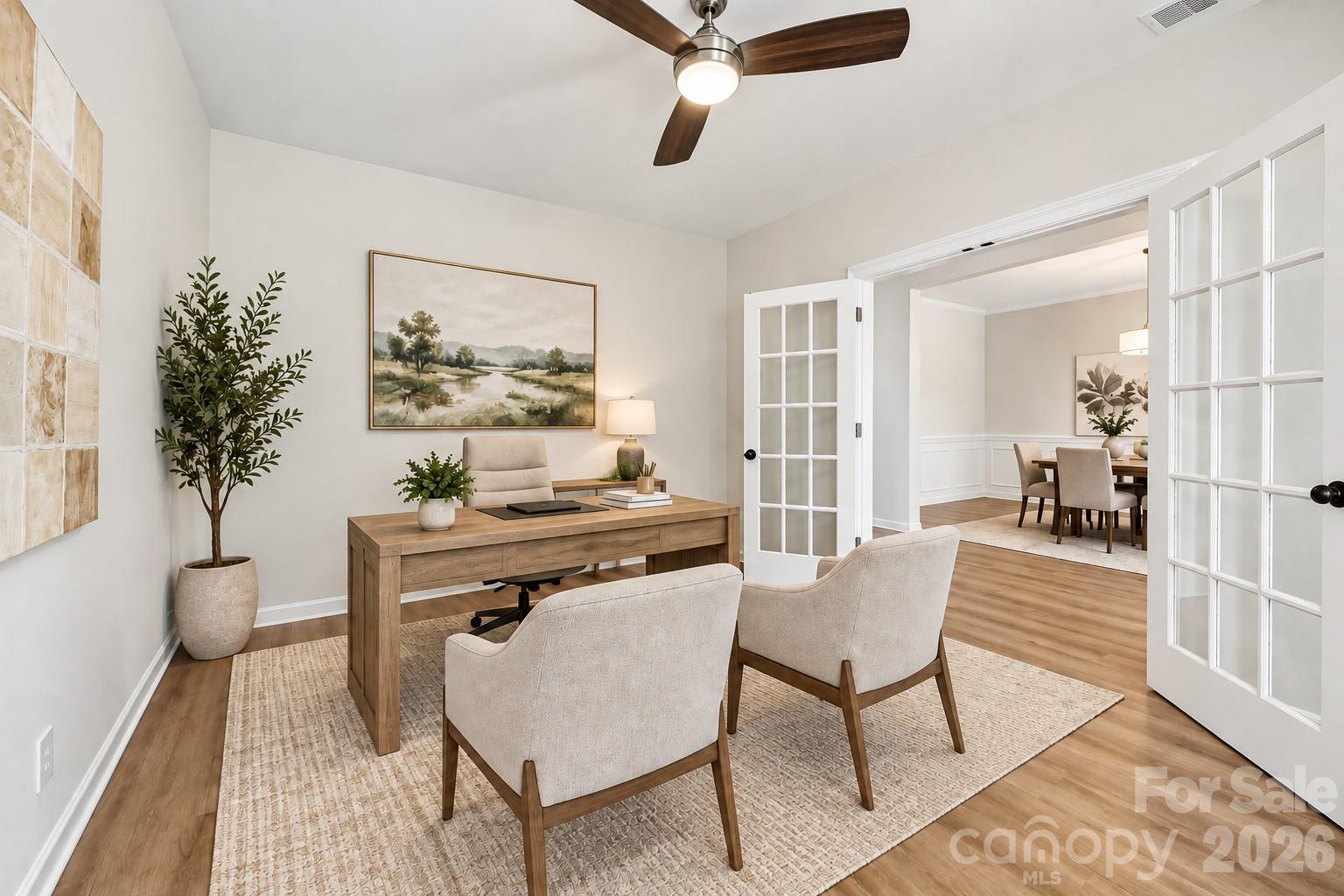 Dedicated home office with French doors offers a private, versatile workspace - 2015 Kensley Drive, Waxhaw