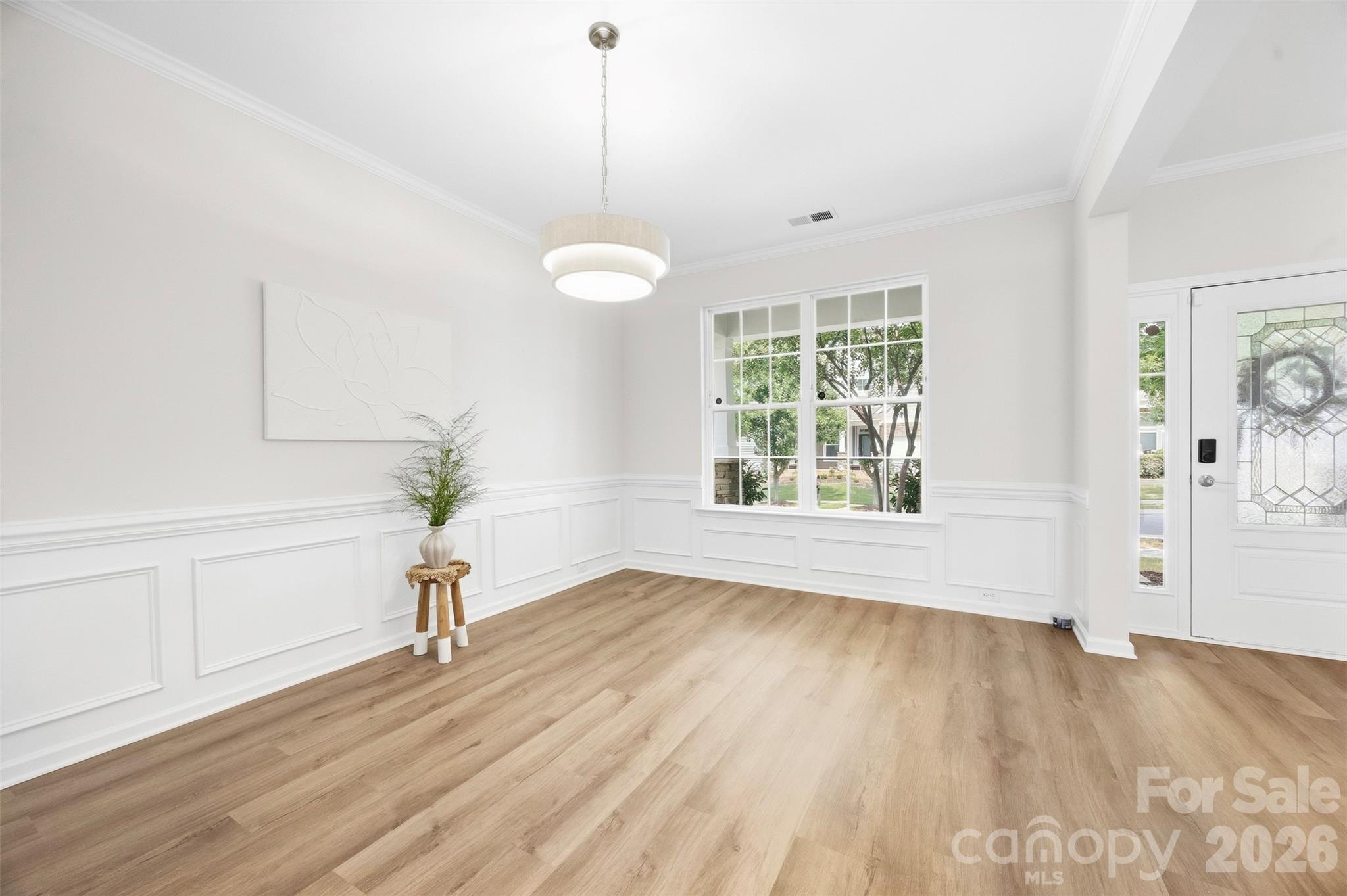 Large front-facing window brings natural light into the dining room - 2015 Kensley Drive, Waxhaw